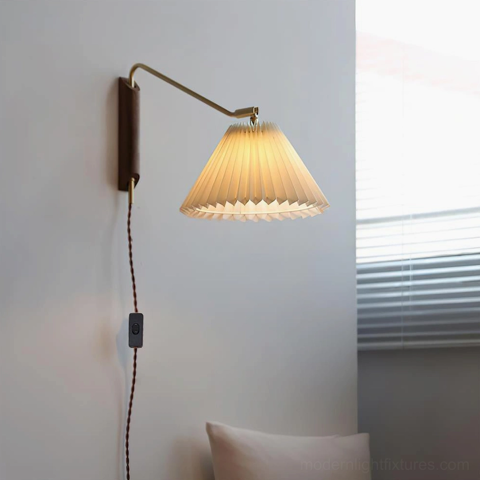 Dorset wall sconce in walnut color mounted in bedroom corner with pleated fabric shade