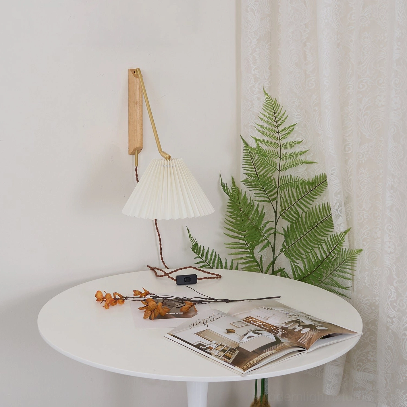 Dorset pleated wall lamp in wood color finish mounted in Scandinavian interior