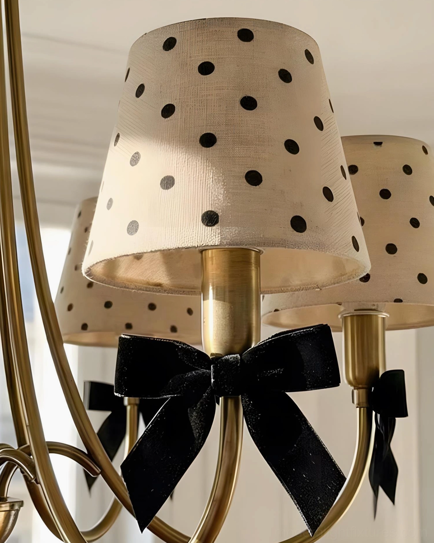 Dot chandelier lighting fixture in black finish with polka dot pattern detail