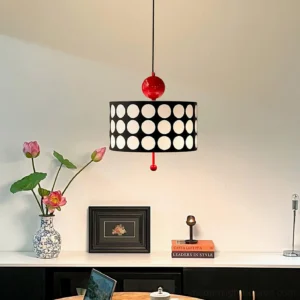 Dottie retro pendant light hanging above vintage console table with home decor styling