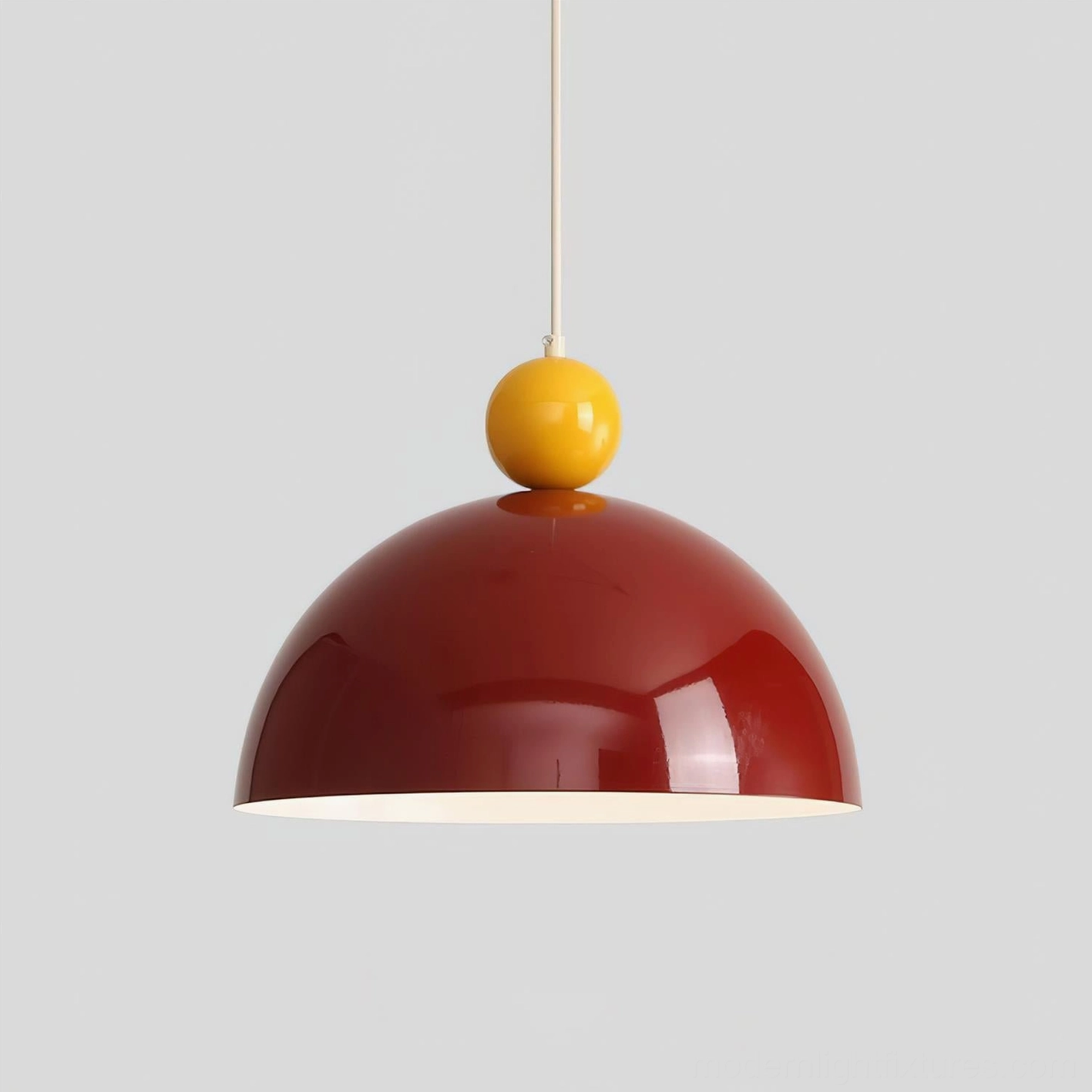 Dotto pendant light fixture detail shot emphasizing glossy metal finish, geometric dome shape, and dual-tone color-blocking design