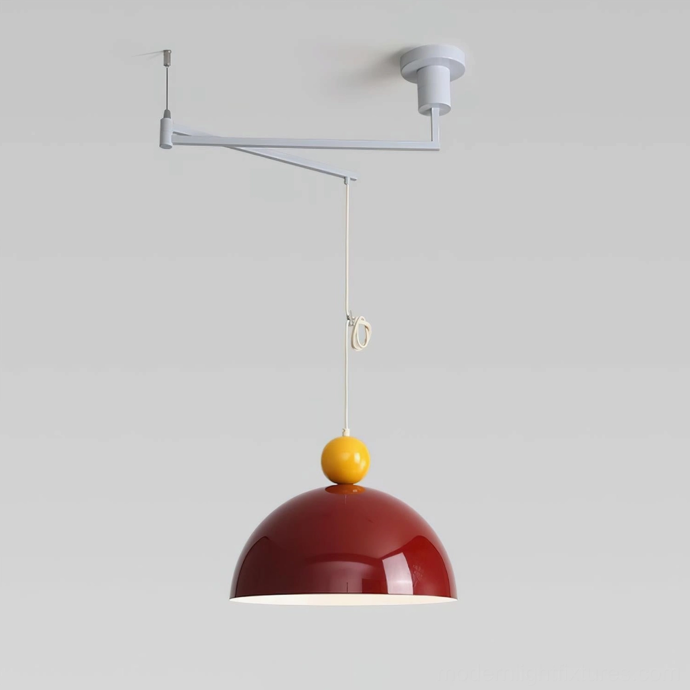 Red Dotto swing arm pendant light with yellow spherical top - bold color statement fixture
