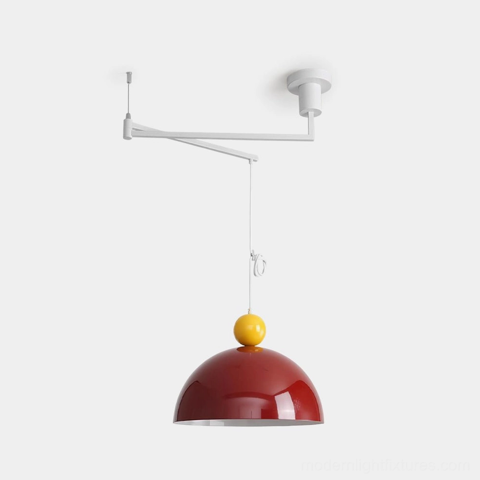 Dotto swing arm pendant light with red dome shade and yellow spherical accent on white metal arm - front studio view