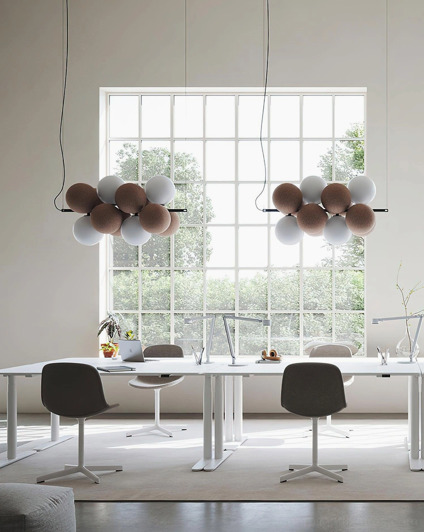 Dual bubble cluster pendant lights in minimalist office meeting room with mixed brown and off-white spheres