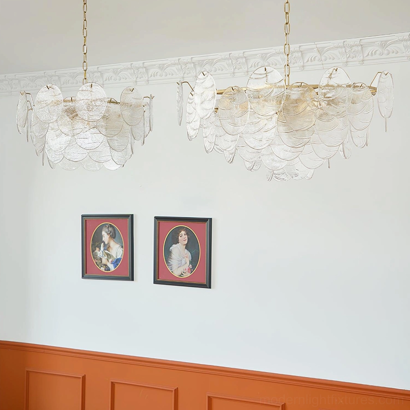Pair of matching gold disc Victorian glass chandeliers in retro dining room with wainscoting