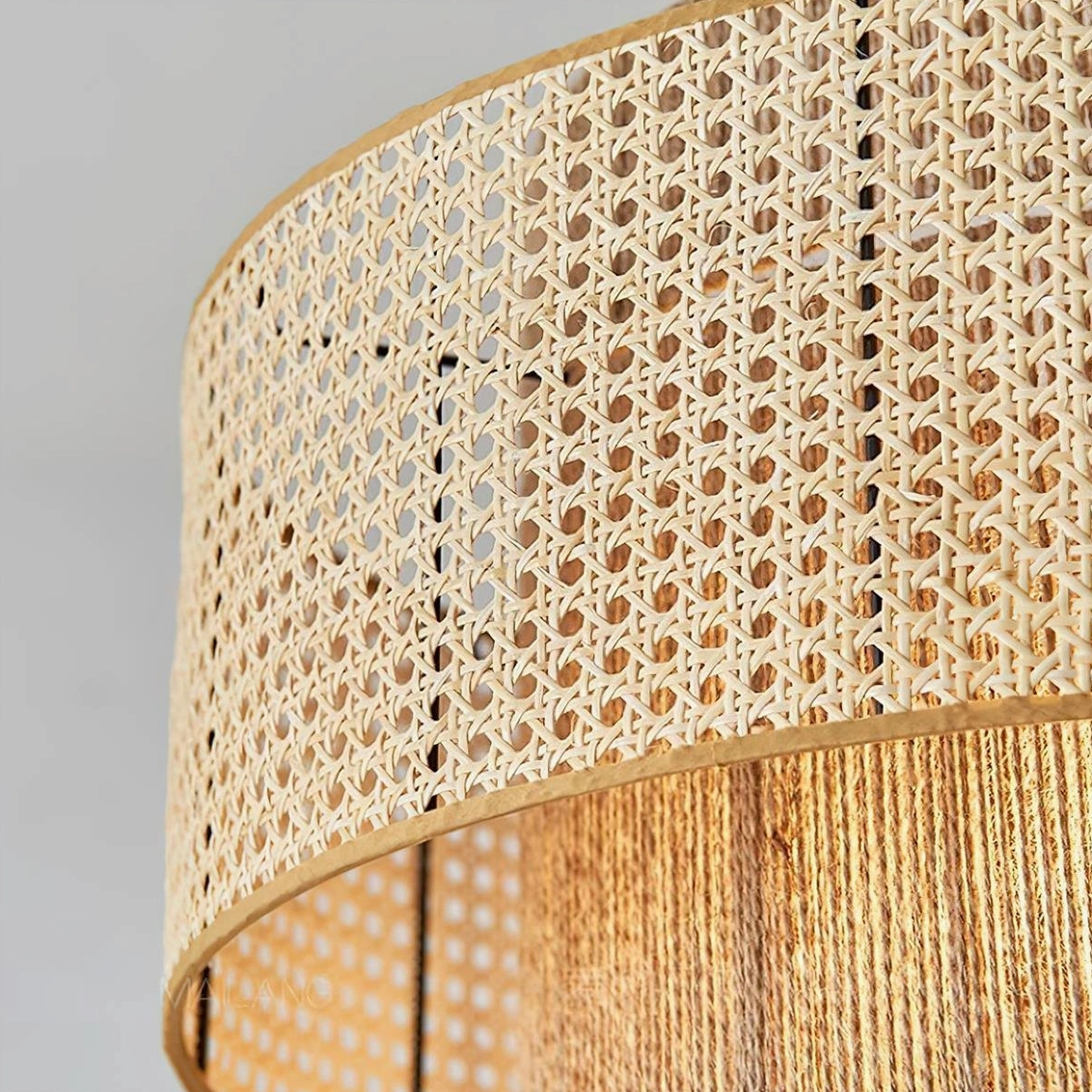 Double-layer rattan pendant light fixture detail showing woven rattan material quality and construction technique
