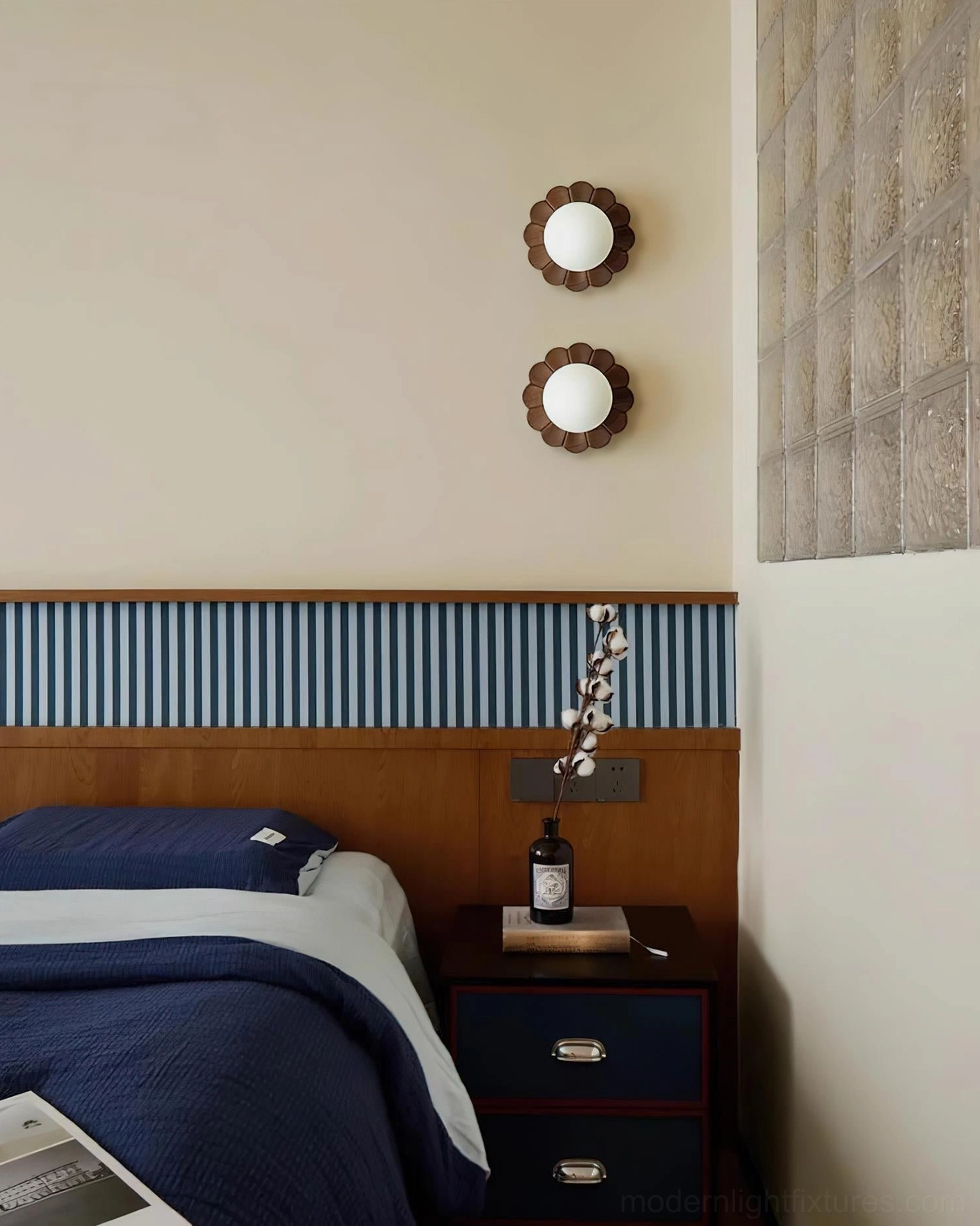 Pair of matching botanical petal wall sconces as bedside lighting in master bedroom decor