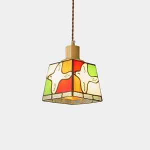 Dove stained glass pendant light with brass fixture on white background, front studio view showing colorful glass pattern
