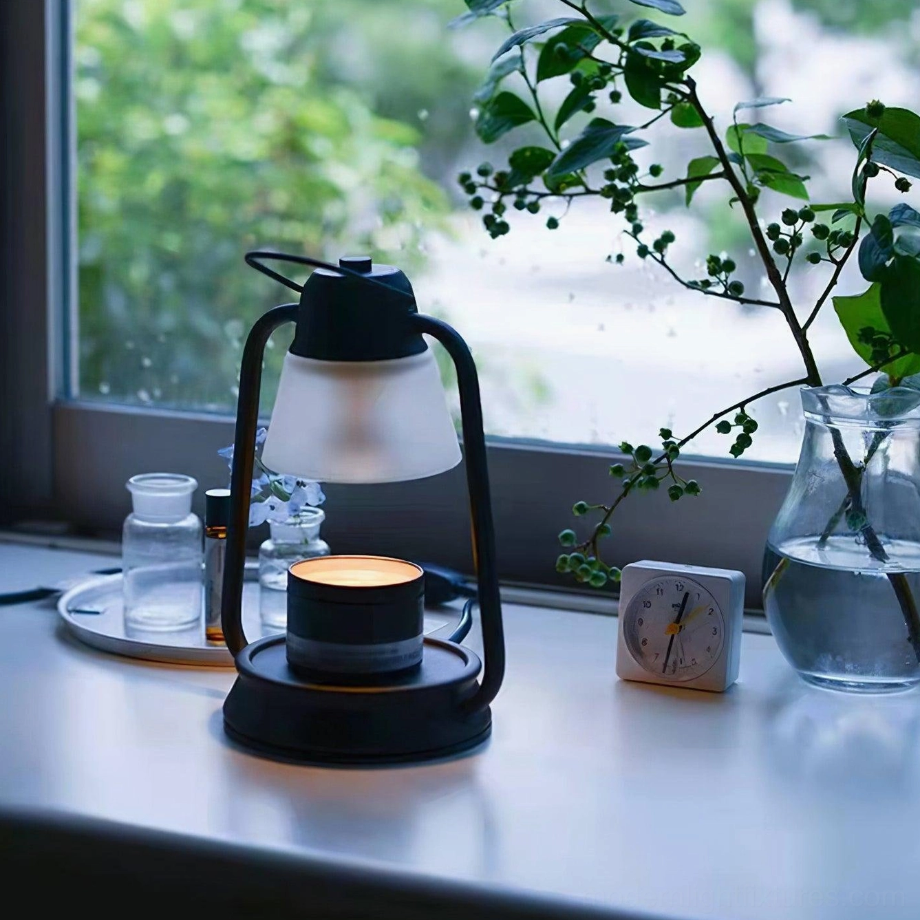 Contemporary table lamp candle warmer three-quarter angle windowsill minimalist design