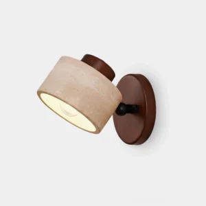 Driftstone travertine wall sconce with wood accents, three-quarter front view showing cylindrical stone shade and minimalist design