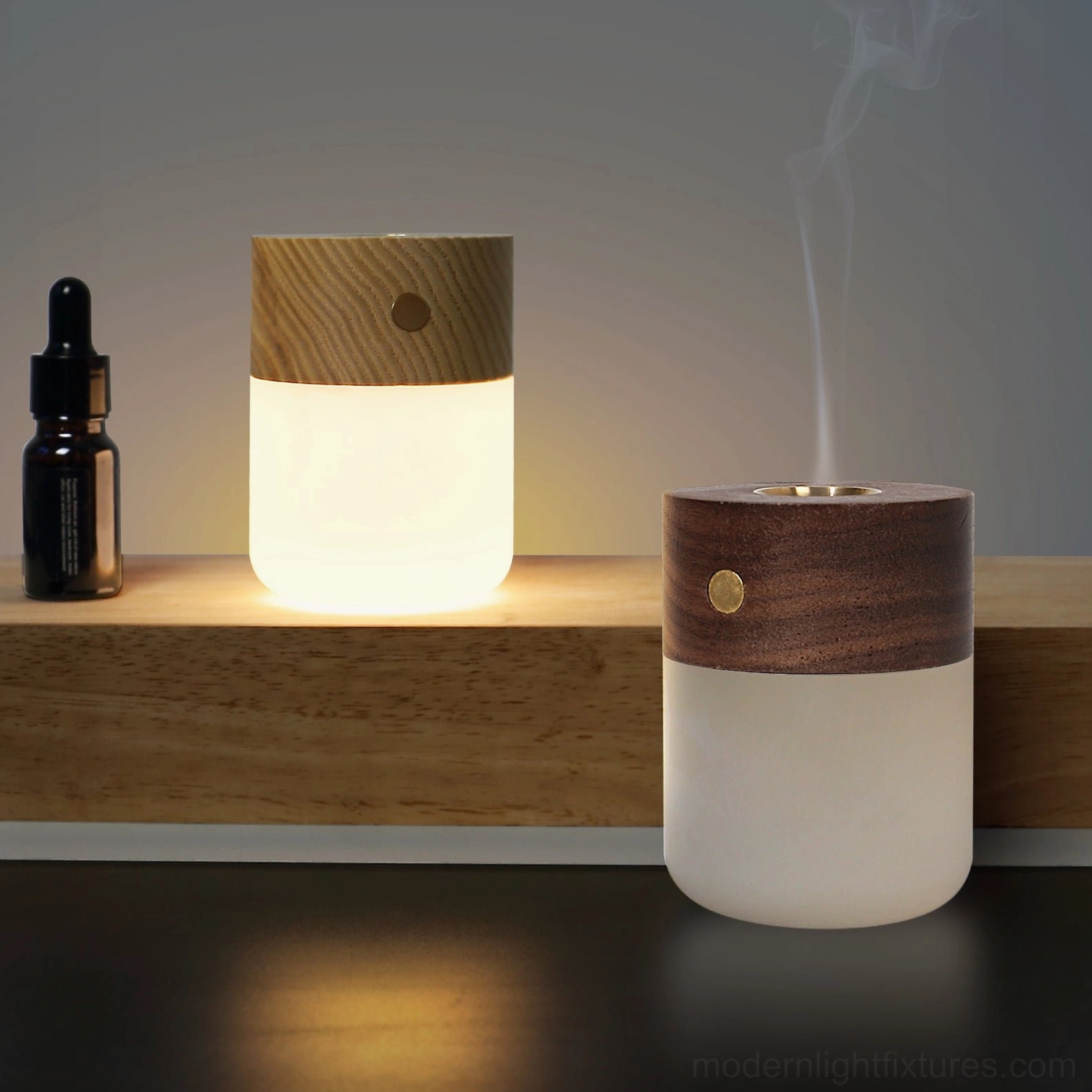 Two matching aroma diffuser lamps with different wood finishes displayed on wall-mounted shelf