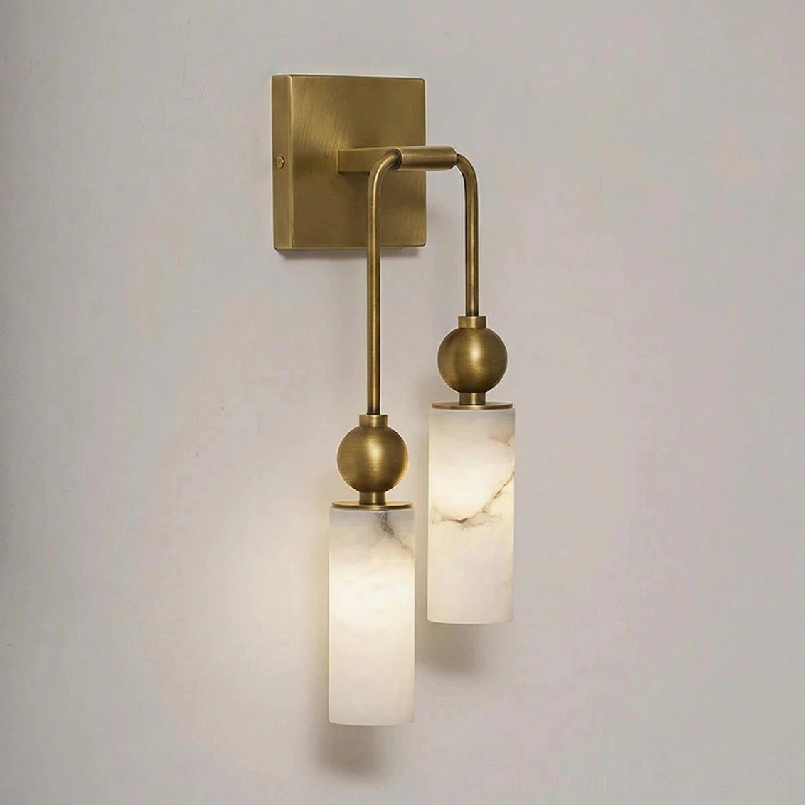 Modern dual-head alabaster wall sconce front flat product view - brushed brass metal frame with translucent stone-like shades