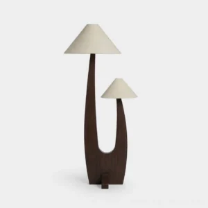Sculptural dual-shade walnut floor lamp with cream linen cone shades on white background - front view
