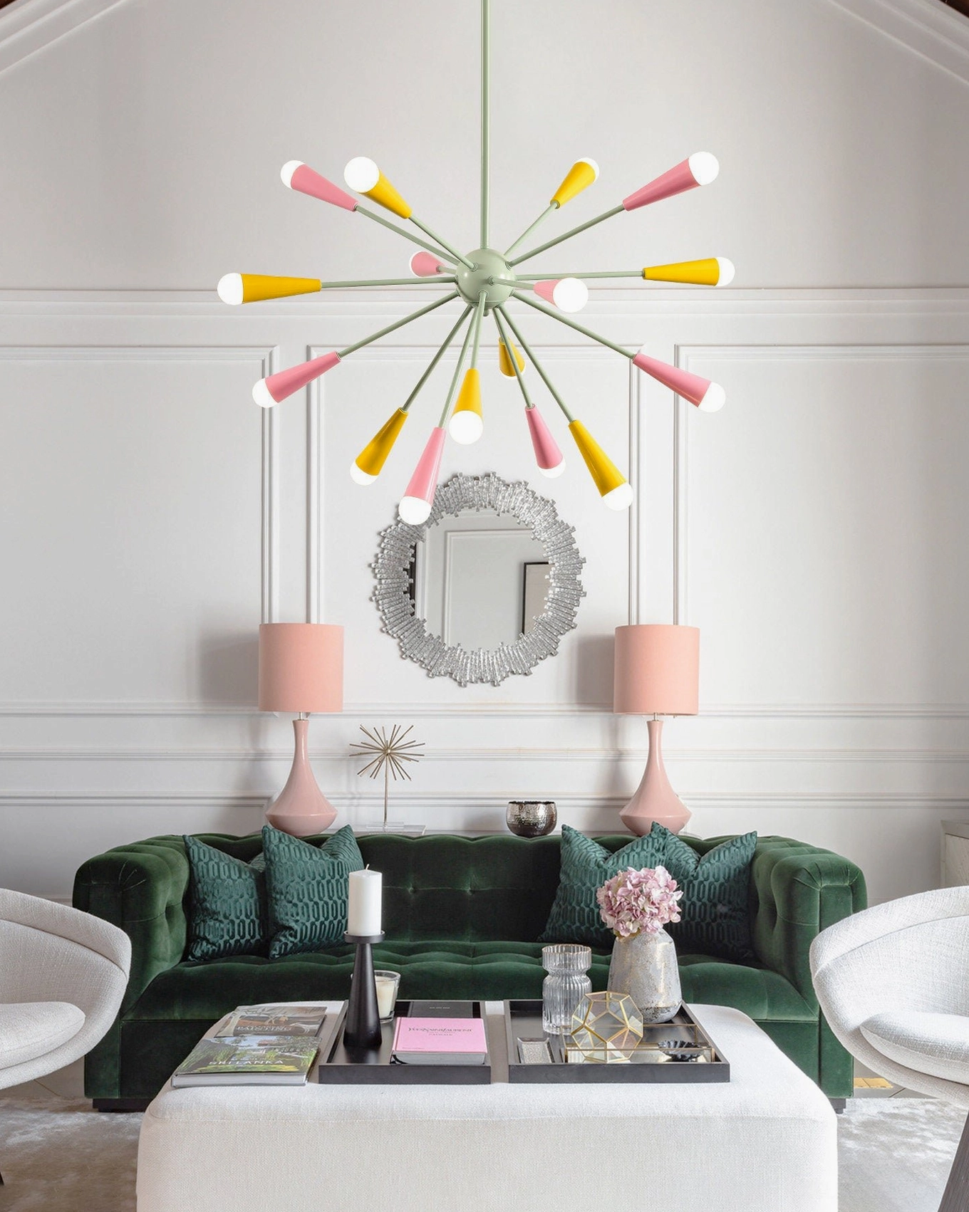 Twin sputnik chandeliers in vintage green velvet living room, pink and yellow starburst pendant lights above mid-century seating with decorative mirror