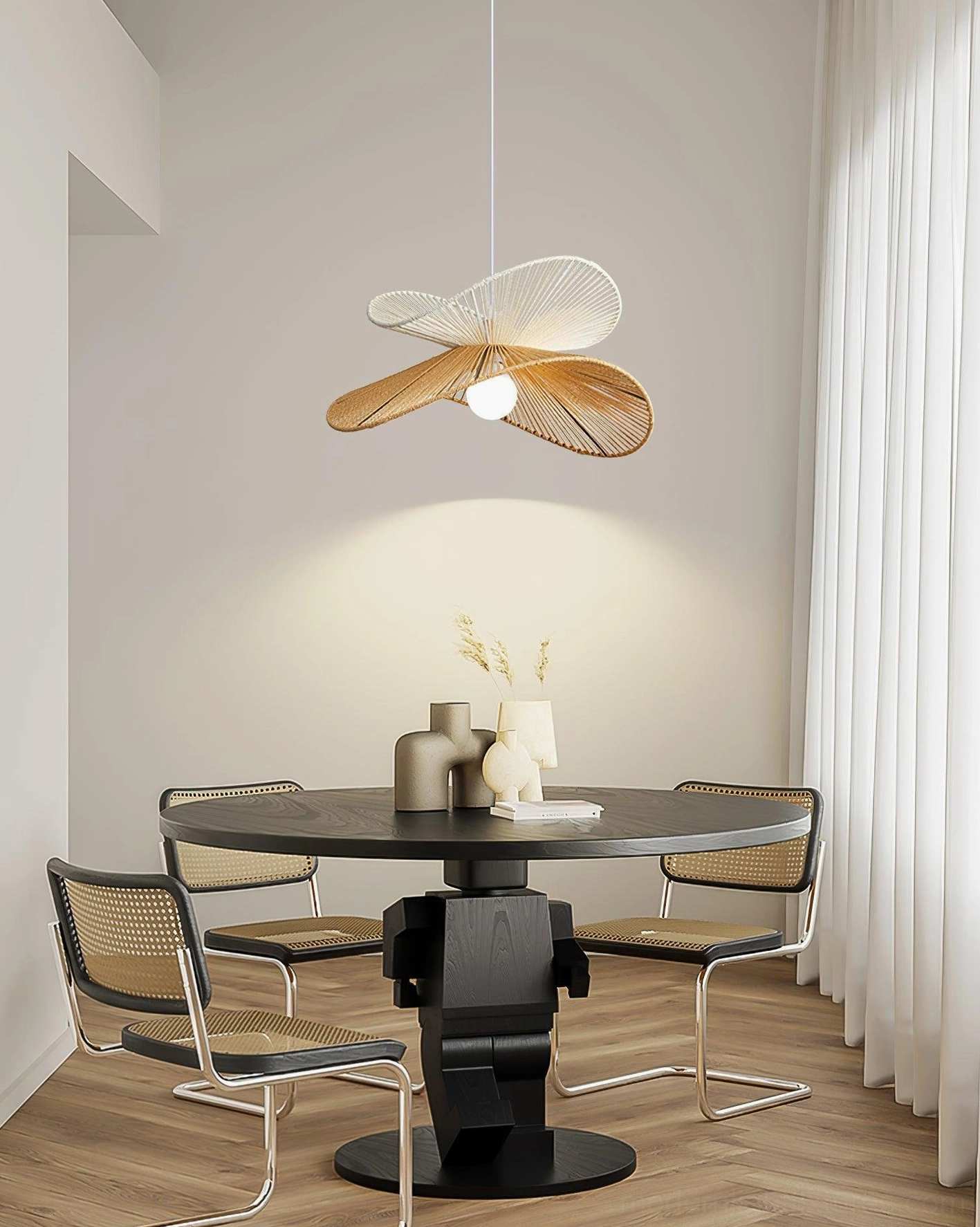 Dual-tone handwoven rattan pendant light in residential dining space with natural lighting
