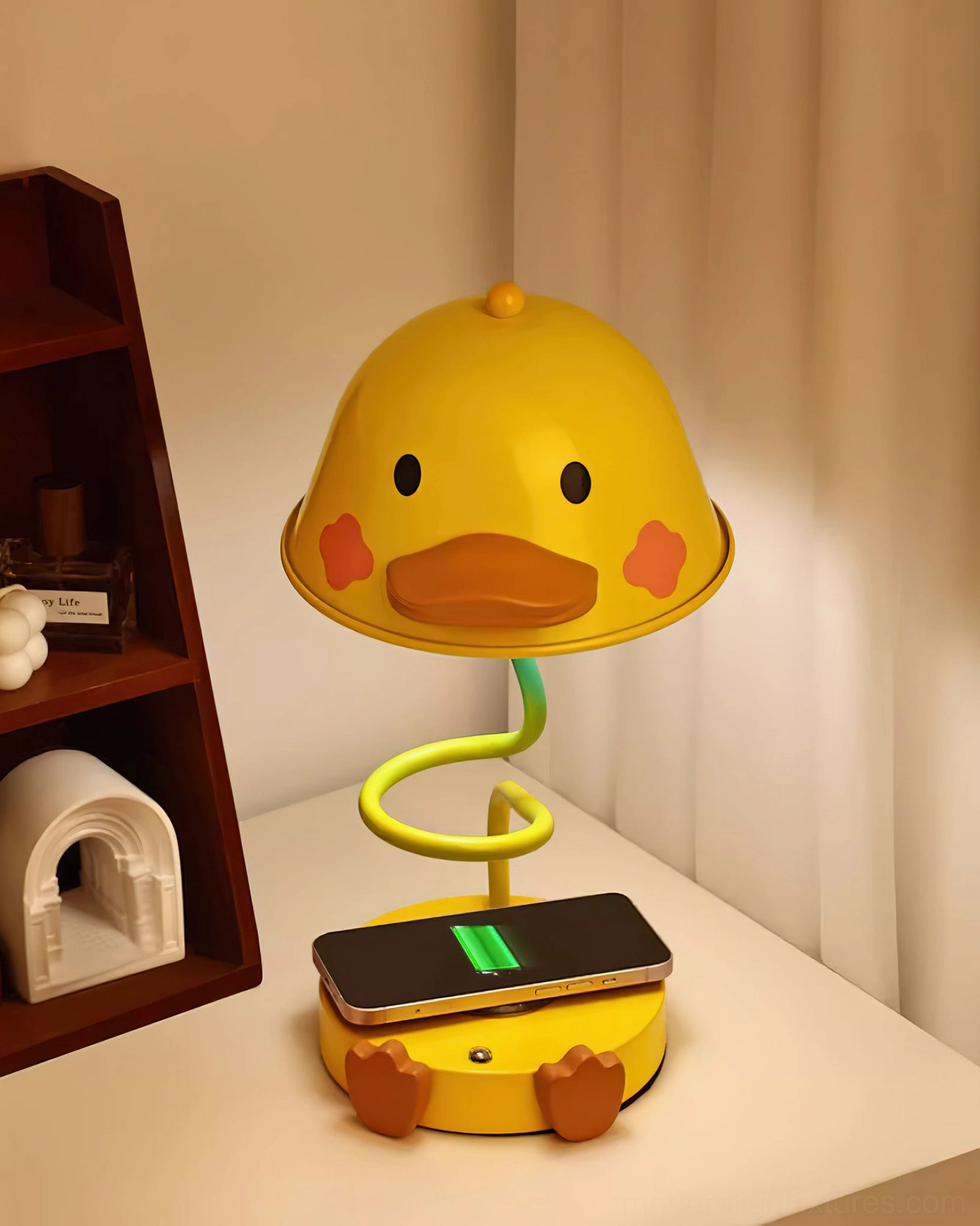 Duck-shaped table lamp product detail showing touch control interface and resin sculptural elements
