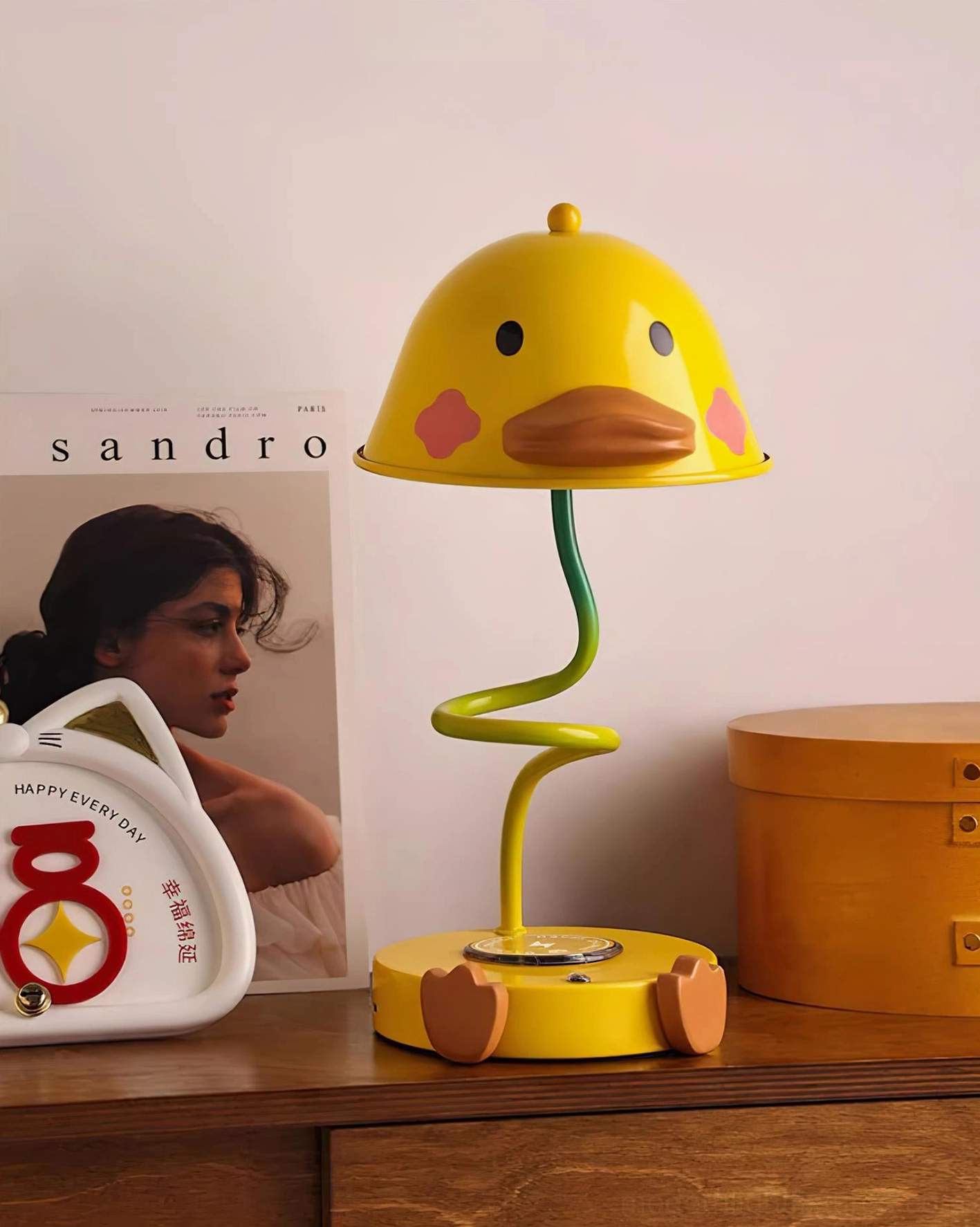 Playful duck table lamp metal body construction with resin accents in warm yellow-brown tone