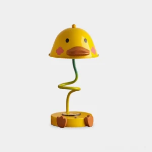 Whimsical yellow duck-shaped touch LED table lamp with metal body displayed on plain white background, front view