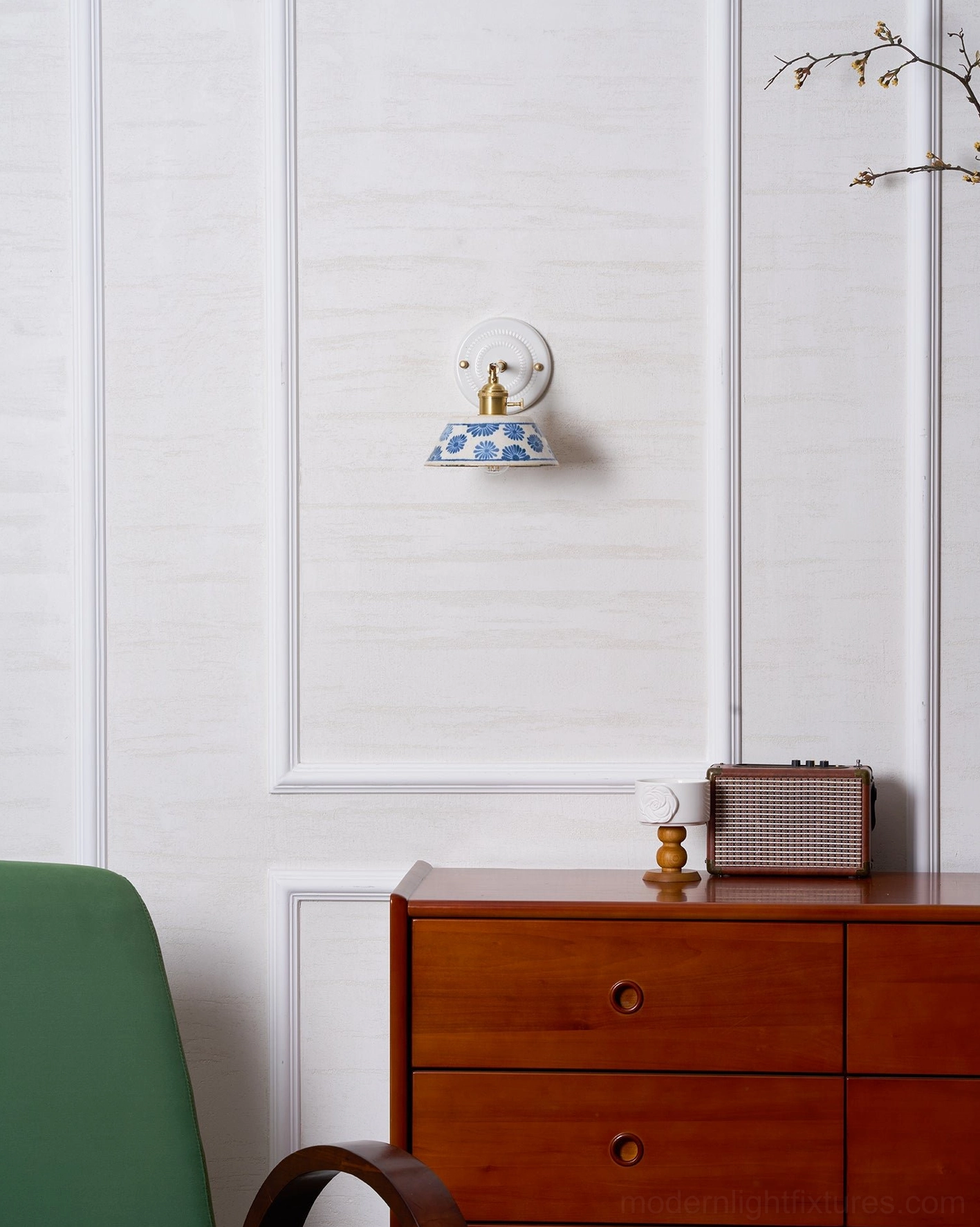 Ceramic wall sconce mounted in eclectic interior with mixed design elements and textures