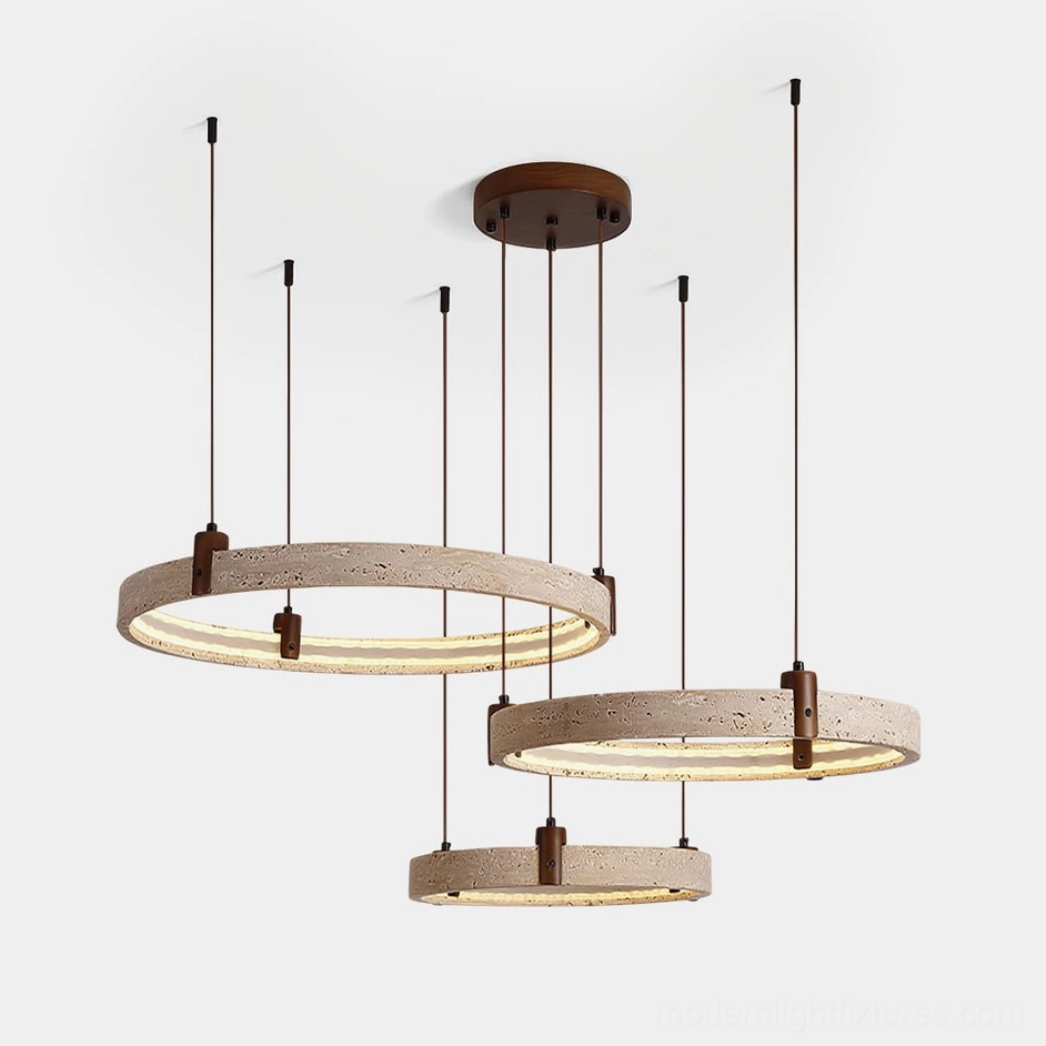 Eclora three-ring travertine chandelier pendant light with warm LED display on white background