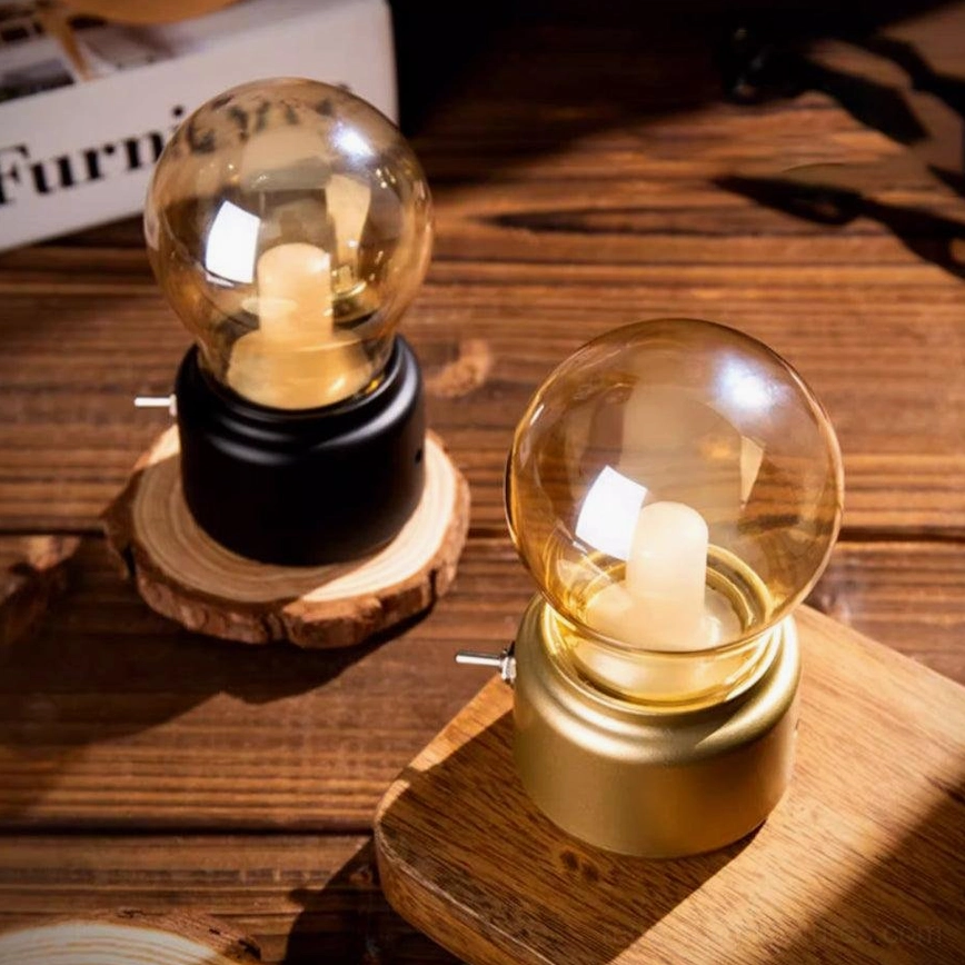 Miniature Edison-style table lamp with clear glass shade warm white glow