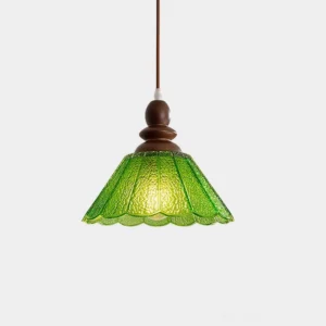 Elara scalloped glass pendant light with textured green crackle shade and walnut wood fixture, front view studio