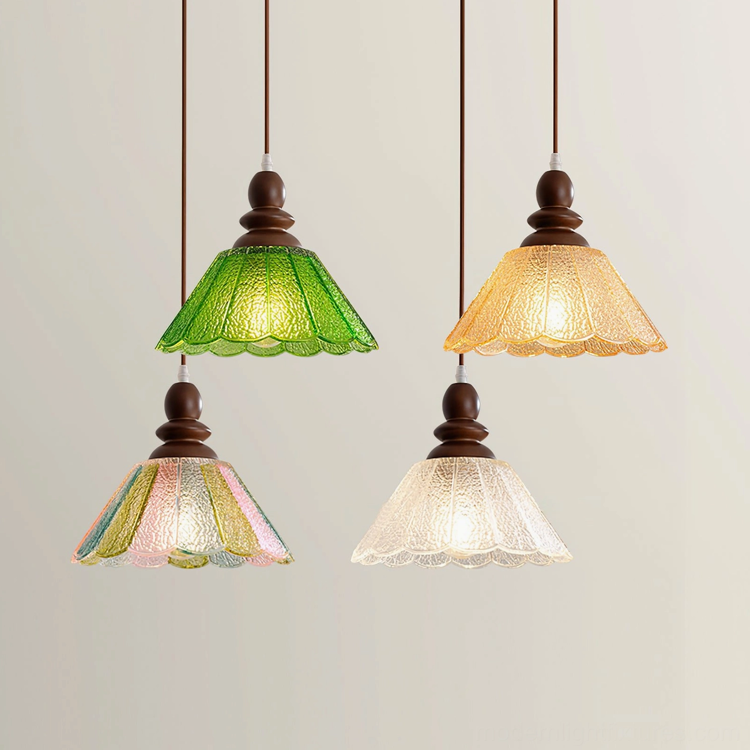 Four-piece Elara scalloped pendant lamp collection with multicolor frosted glass shades including green, amber, clear, and pastel options