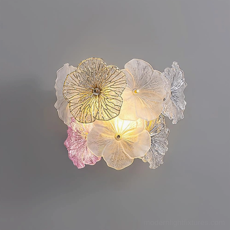 Elaria pink and clear glass wall lamp frontal perspective with warm glowing botanical design