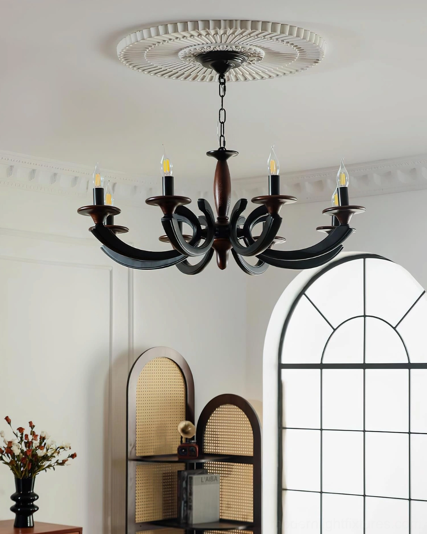 Eldric all-black matte finish chandelier in traditional home interior with arched architectural details and low-angle view