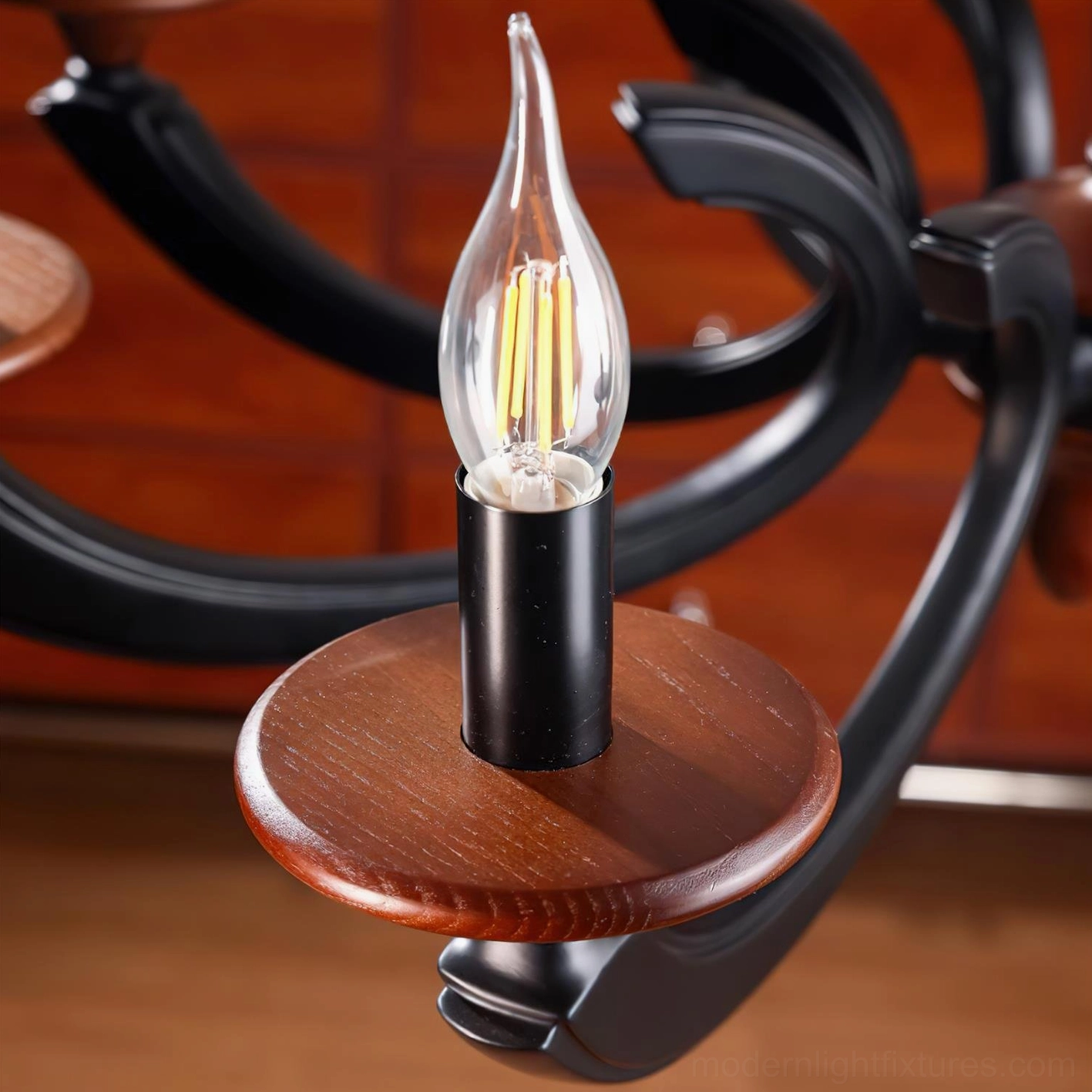 Eldric chandelier E14 socket detail with LED bulb flame-shaped head walnut wood and black metal base