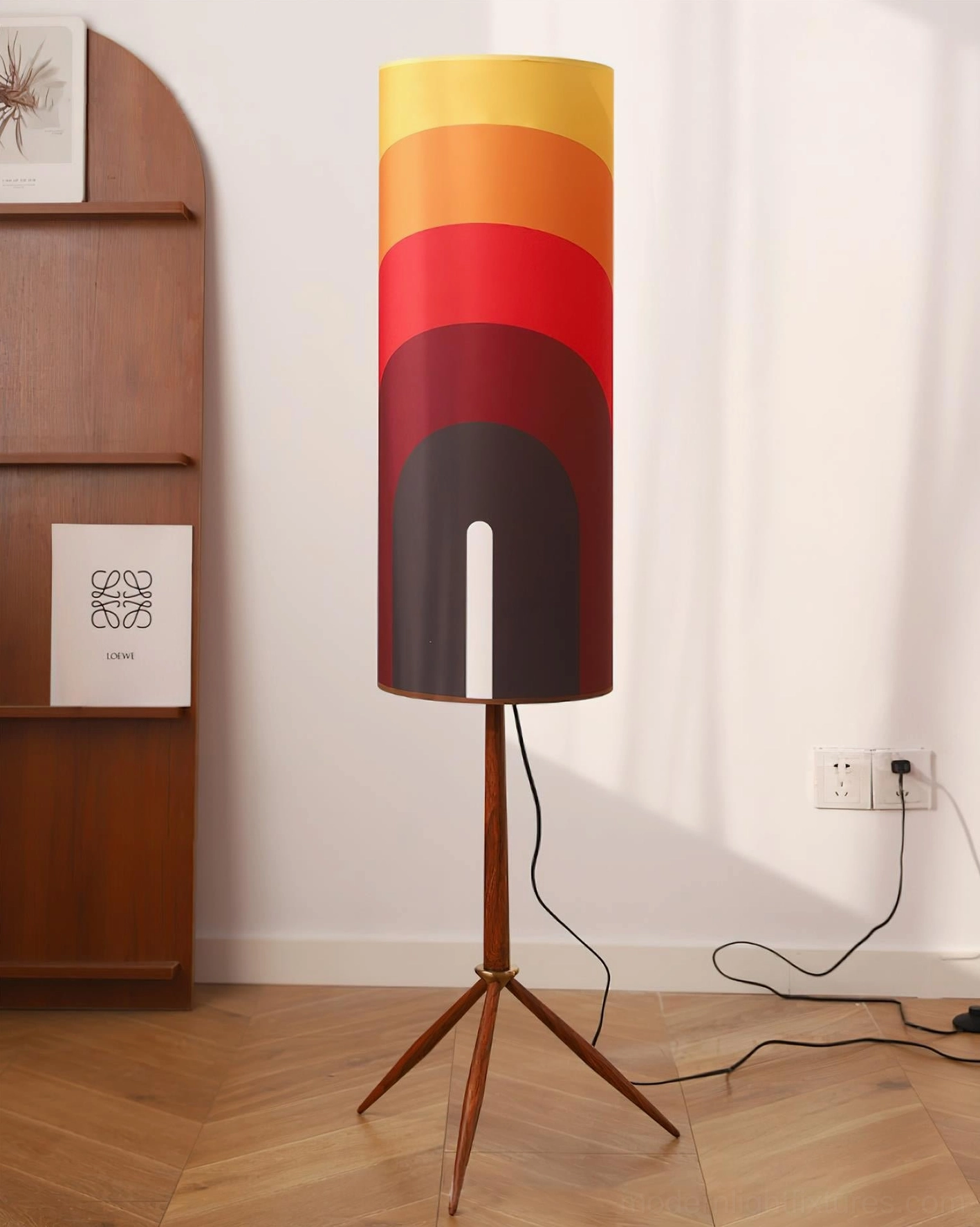 Electra gradient arc floor lamp featuring dark-to-light red-orange transition shade with solid wood tripod base in home setting
