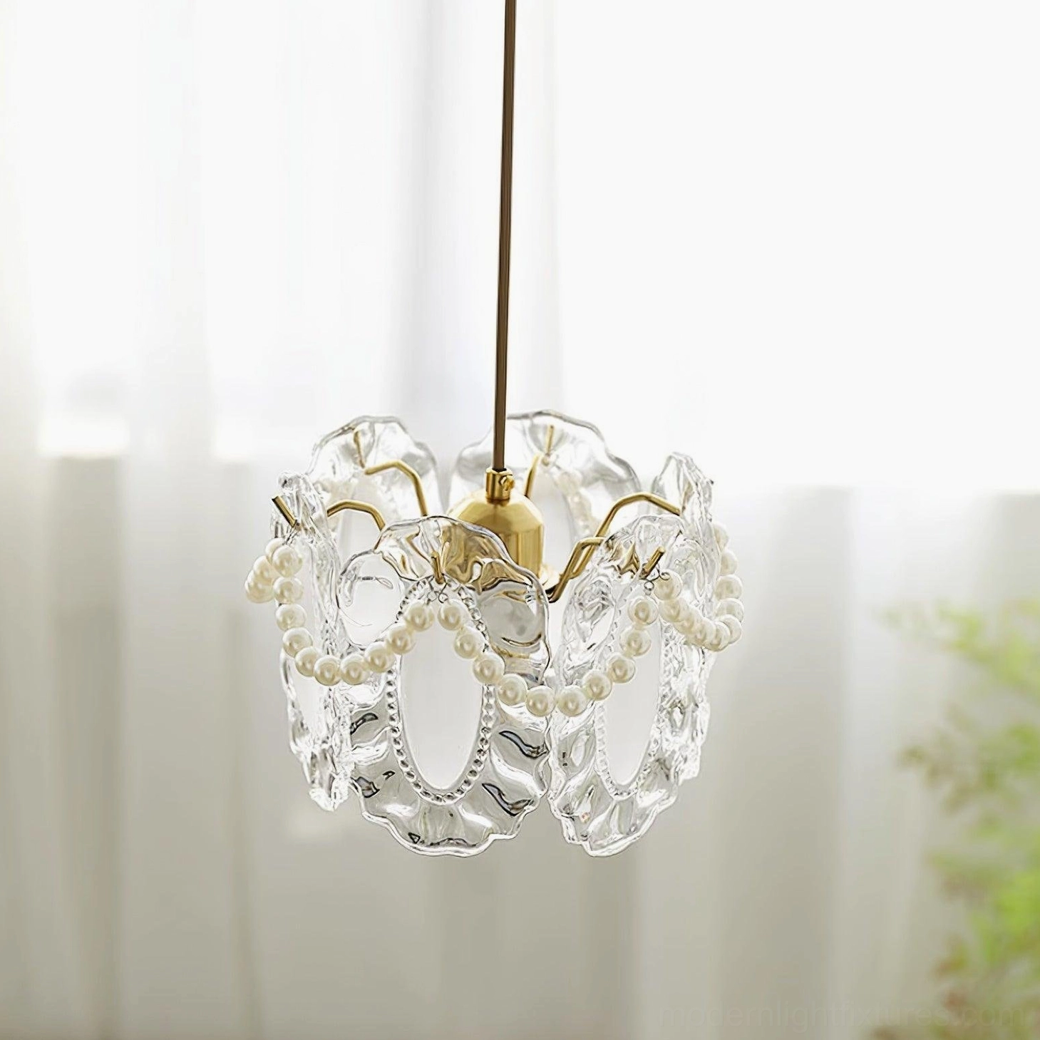 Elegant crystal petal pendant light providing diffused illumination in sophisticated interior design setting