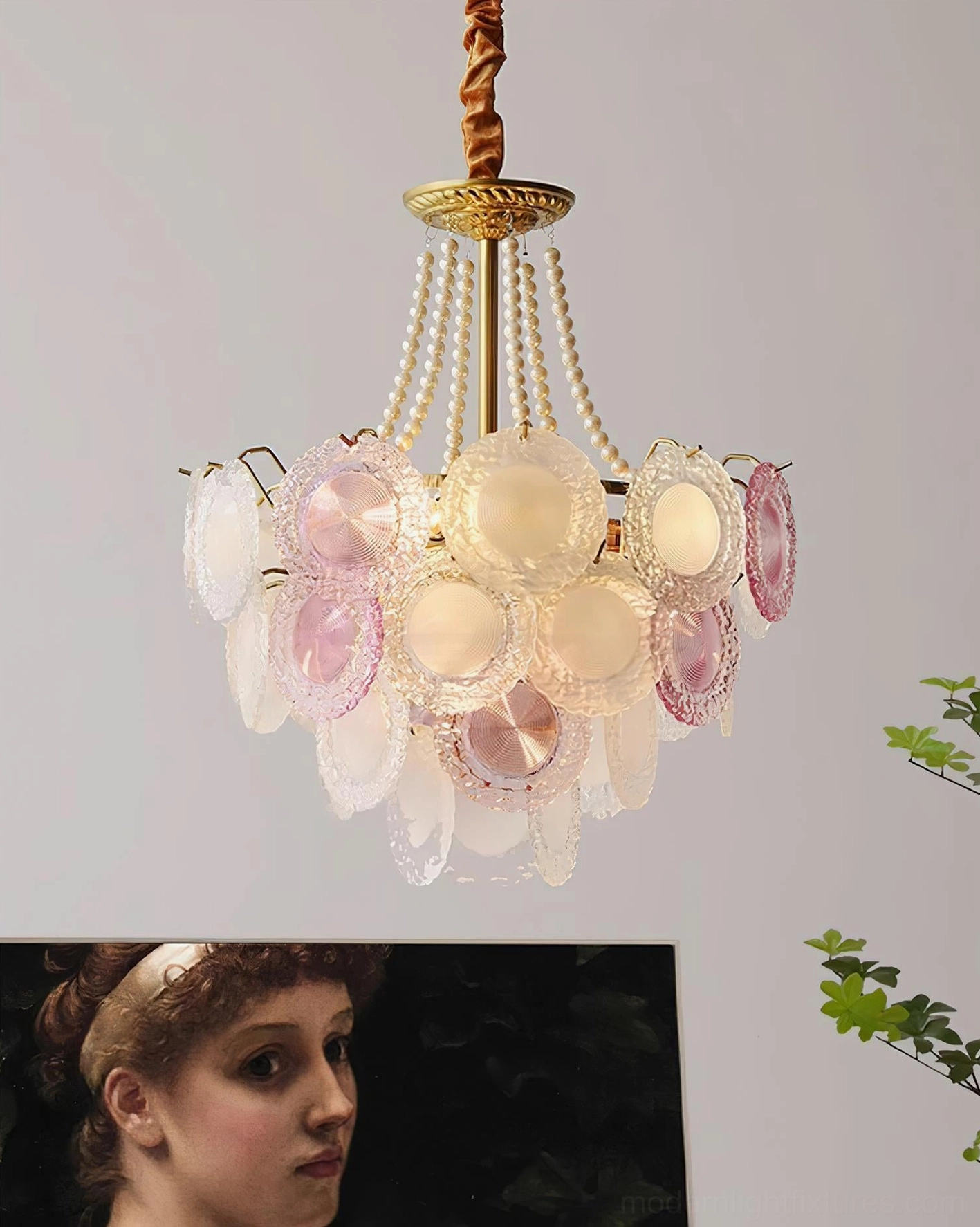 Violaire blush pink chandelier in elegant dining room creating warm ambient light for intimate gathering space