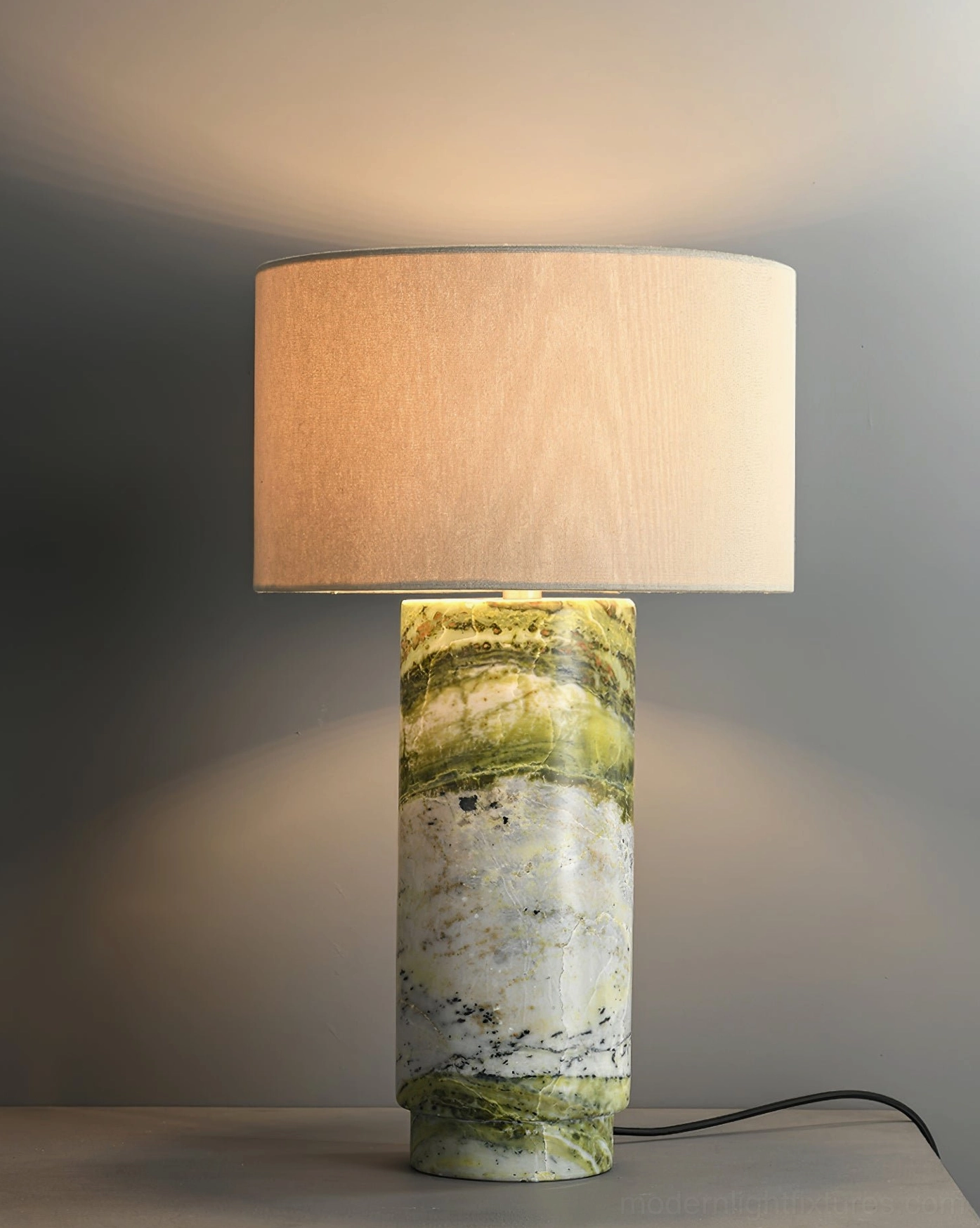 Elegant table lamp with marble base and fabric shade demonstrating timeless minimalist design aesthetic