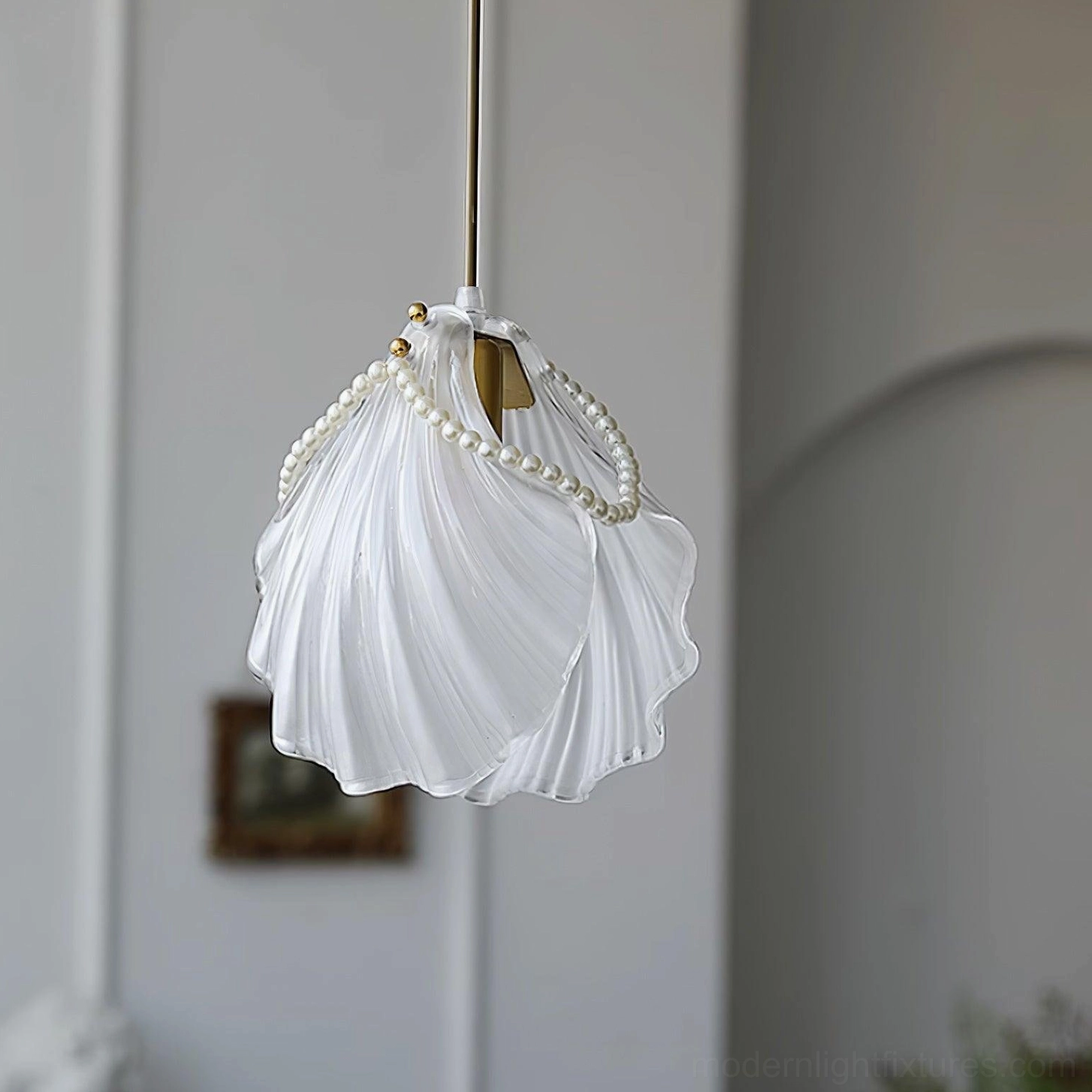 Elegant pearl shell ceiling pendant light with diffused ambient illumination in interior space
