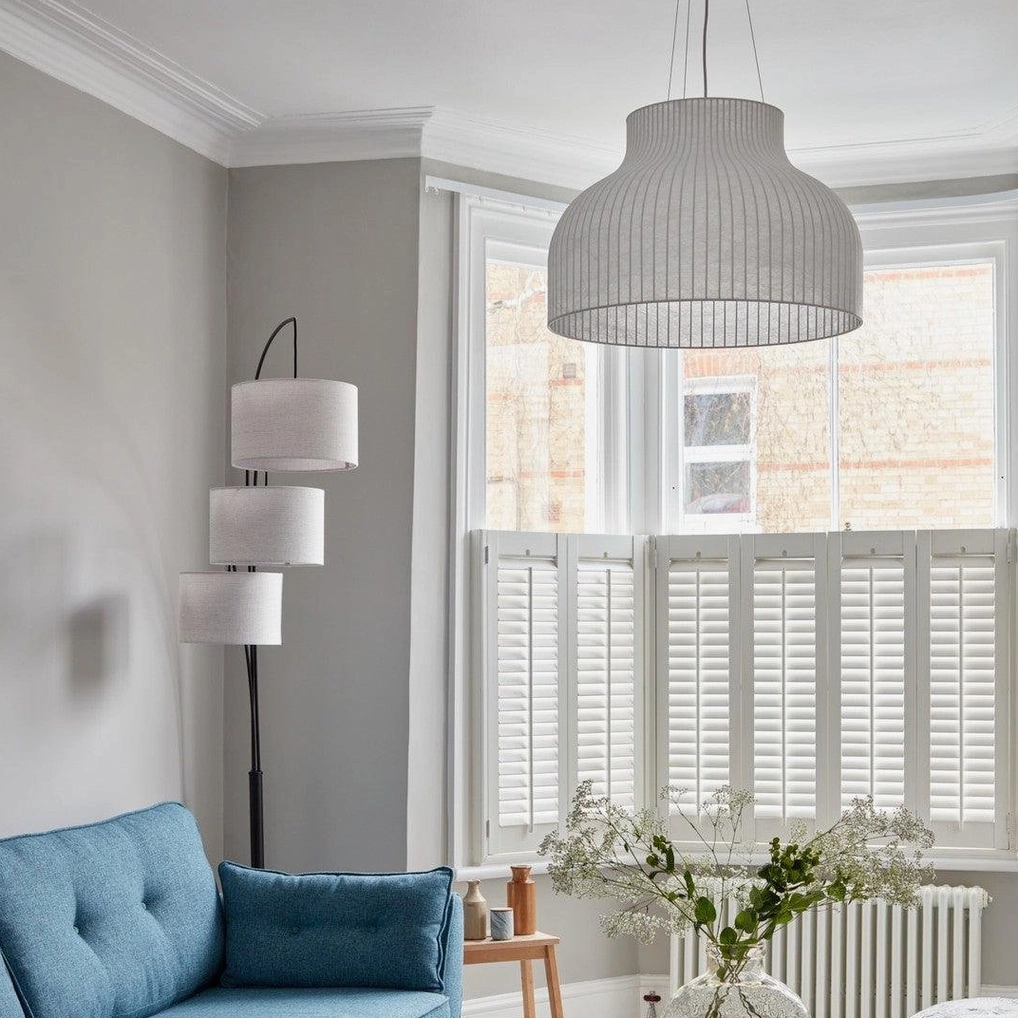 Elegant ribbed pendant shade with layered textile construction and contemporary design aesthetic