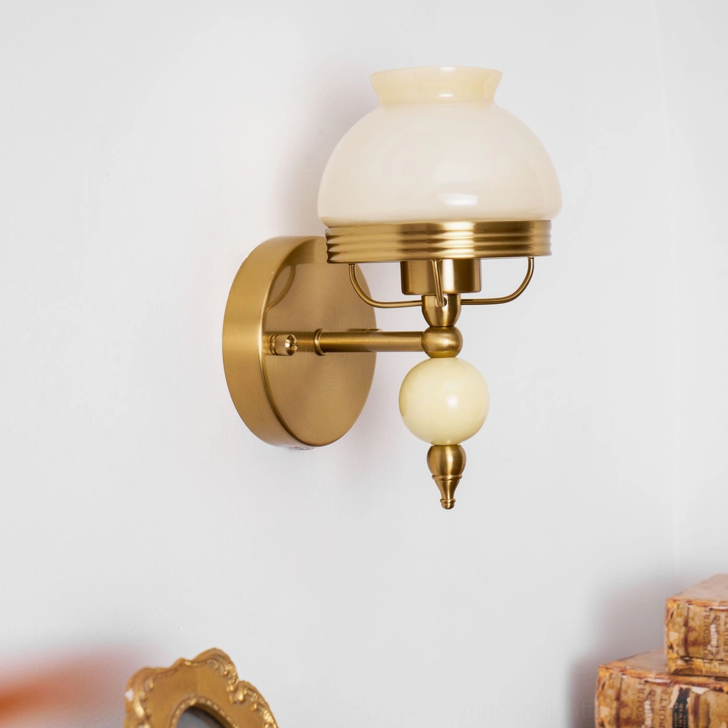 Elegant vintage floral wall sconce with illuminated frosted glass and brass finish