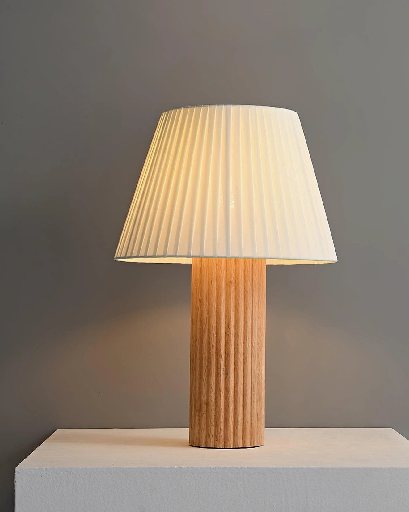 Elegant pleated shade wood table lamp showcasing mid-century modern aesthetic in natural wood finish for sophisticated home décor styling