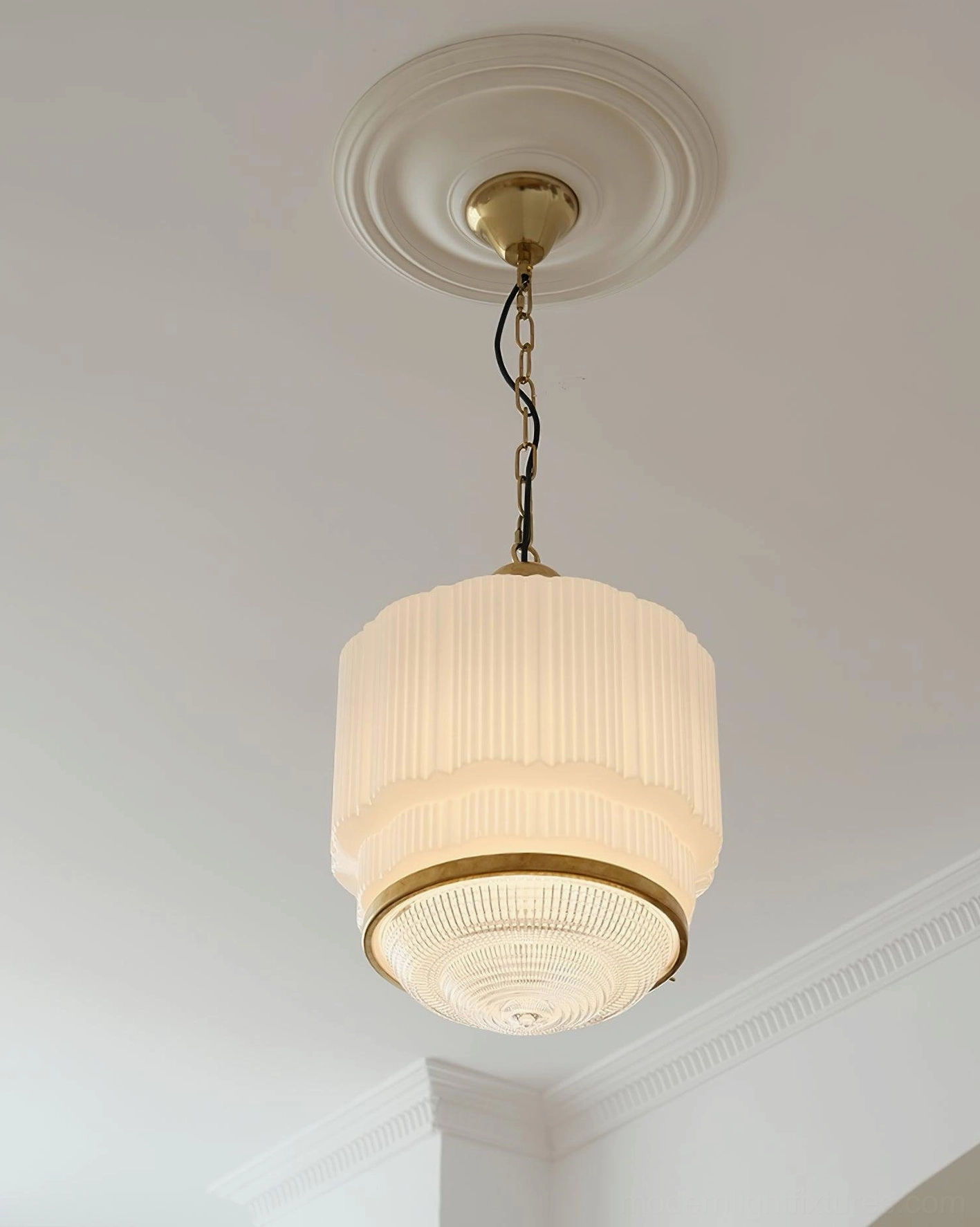 Elena Brass Pendant Light Illuminated - Overhead View Crown Molding Room - Glowing Ribbed Glass Shade