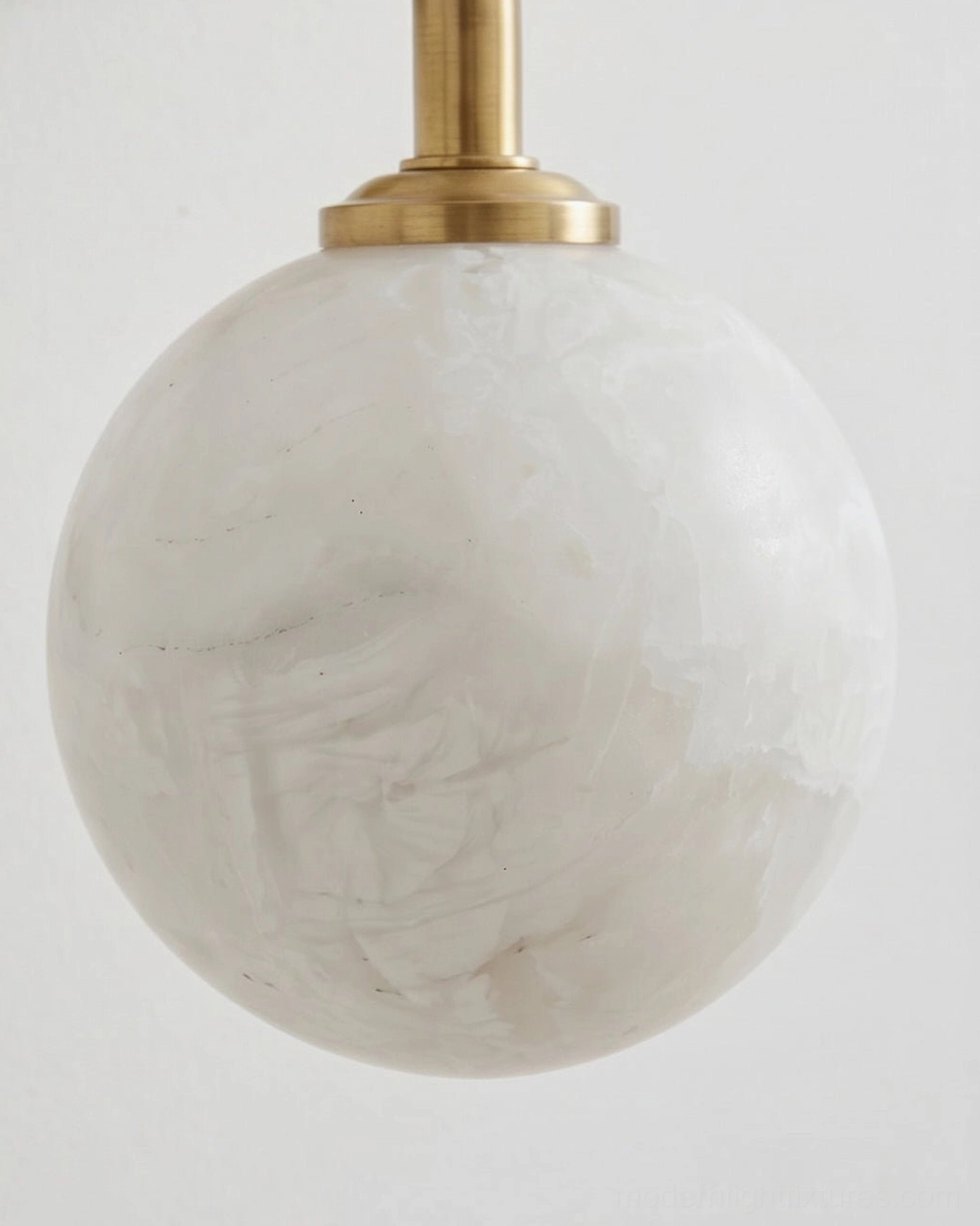 Elio aged brass and alabaster wall sconce mid-century modern design with round backplate and curved arm