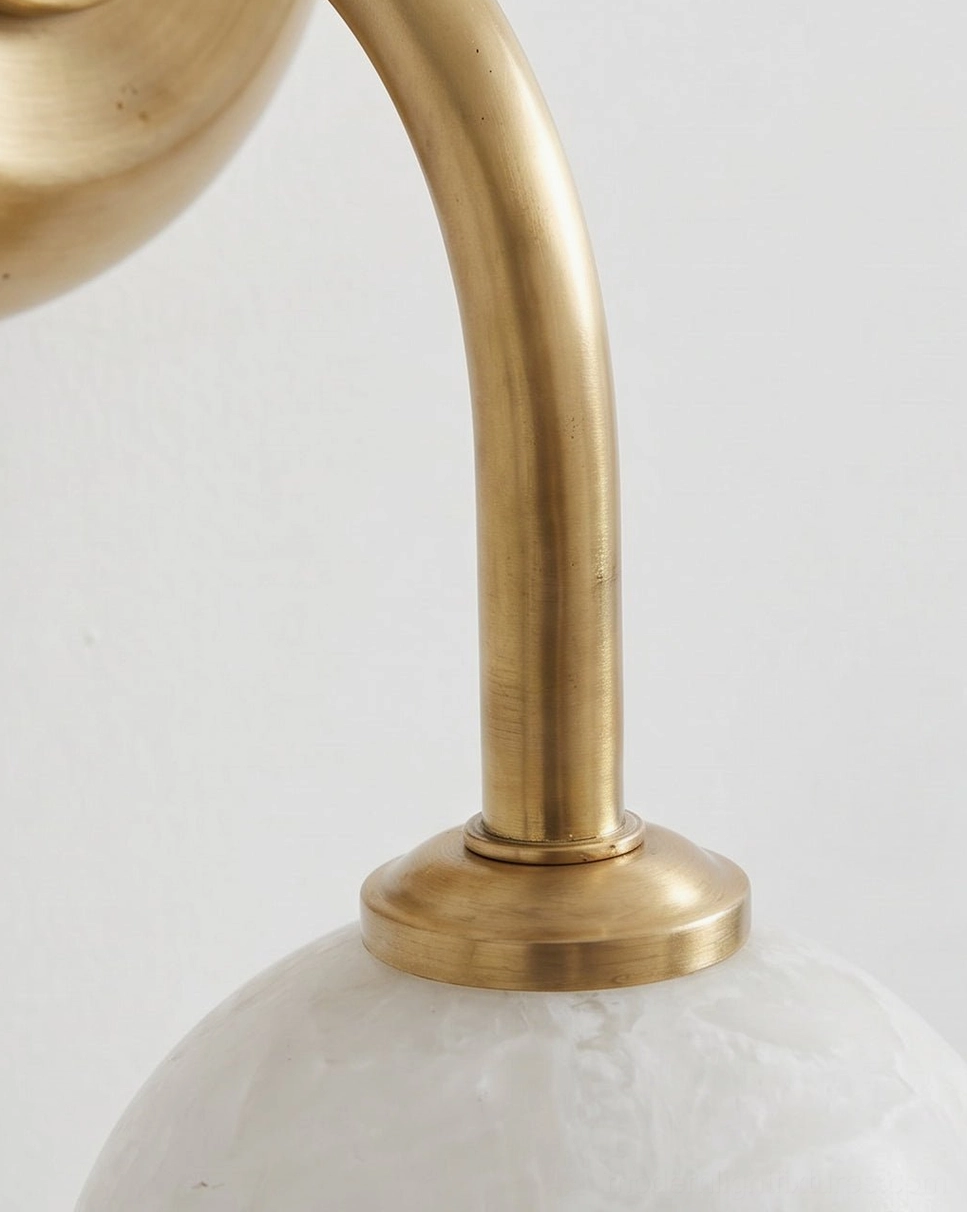 Elio wall sconce full fixture view showing G9 LED warm white light through natural alabaster marble globe