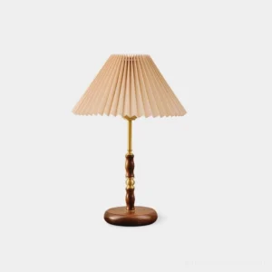 Ella pleated table lamp front view with khaki fabric shade and walnut wood brass base on white studio background