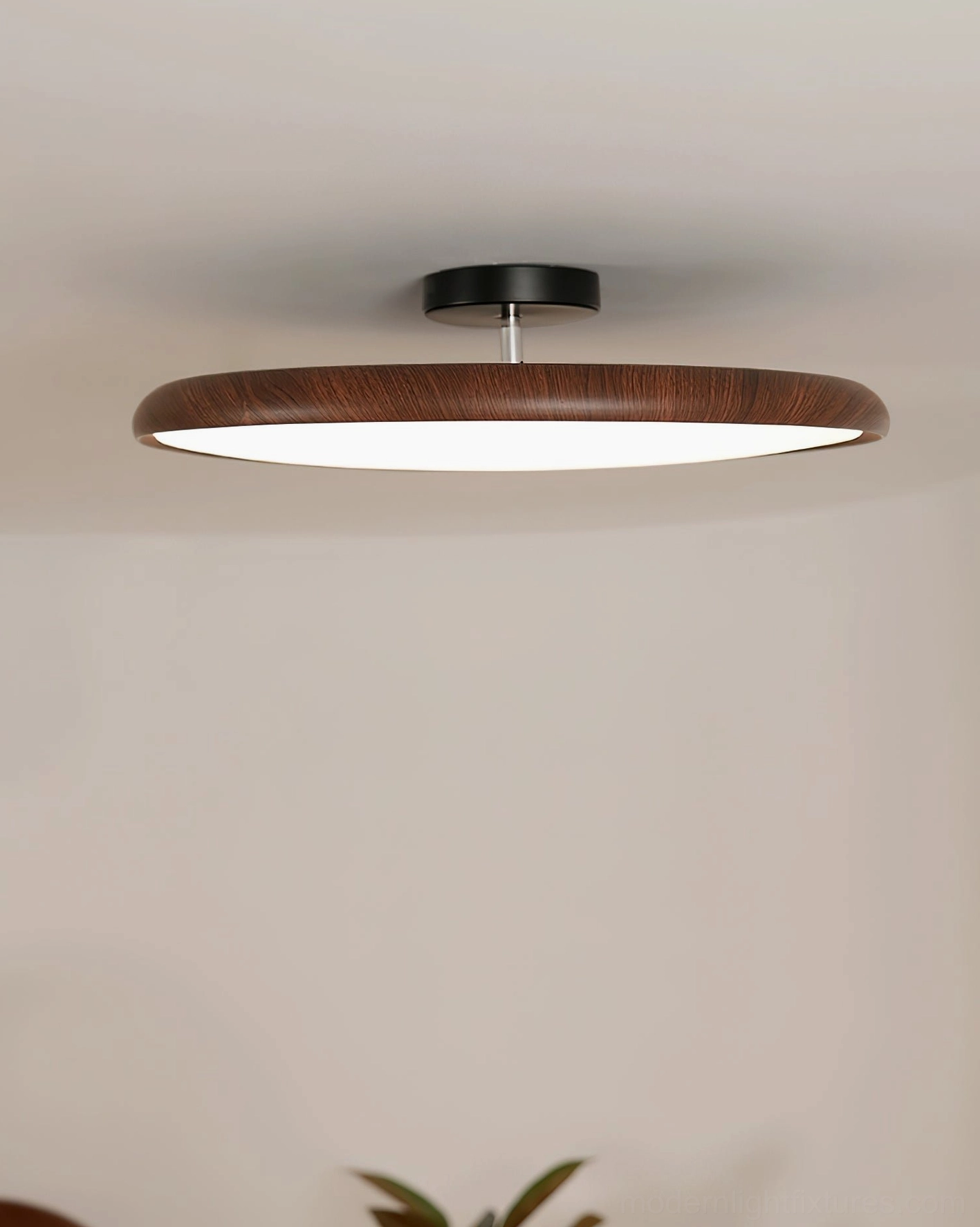 Round flush mount Ellos ceiling light showing uniform acrylic diffuser and white light output