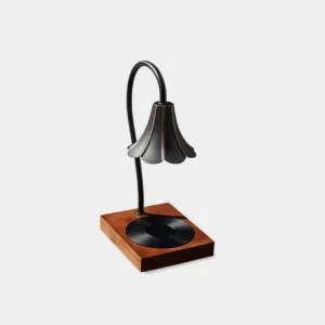 Elodie fluted candle warmer lamp with black metal body and walnut wood base, front three-quarter view on studio white background
