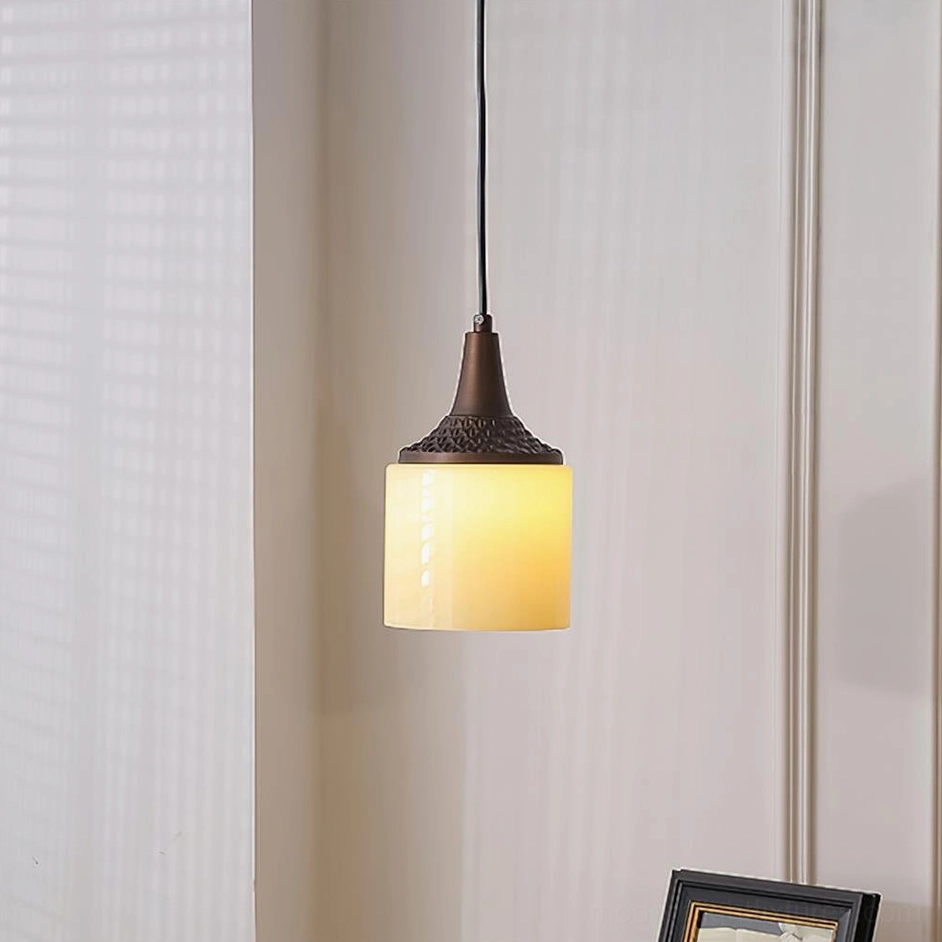 Model A compact pendant light with textured metal cap and spherical frosted glass shade