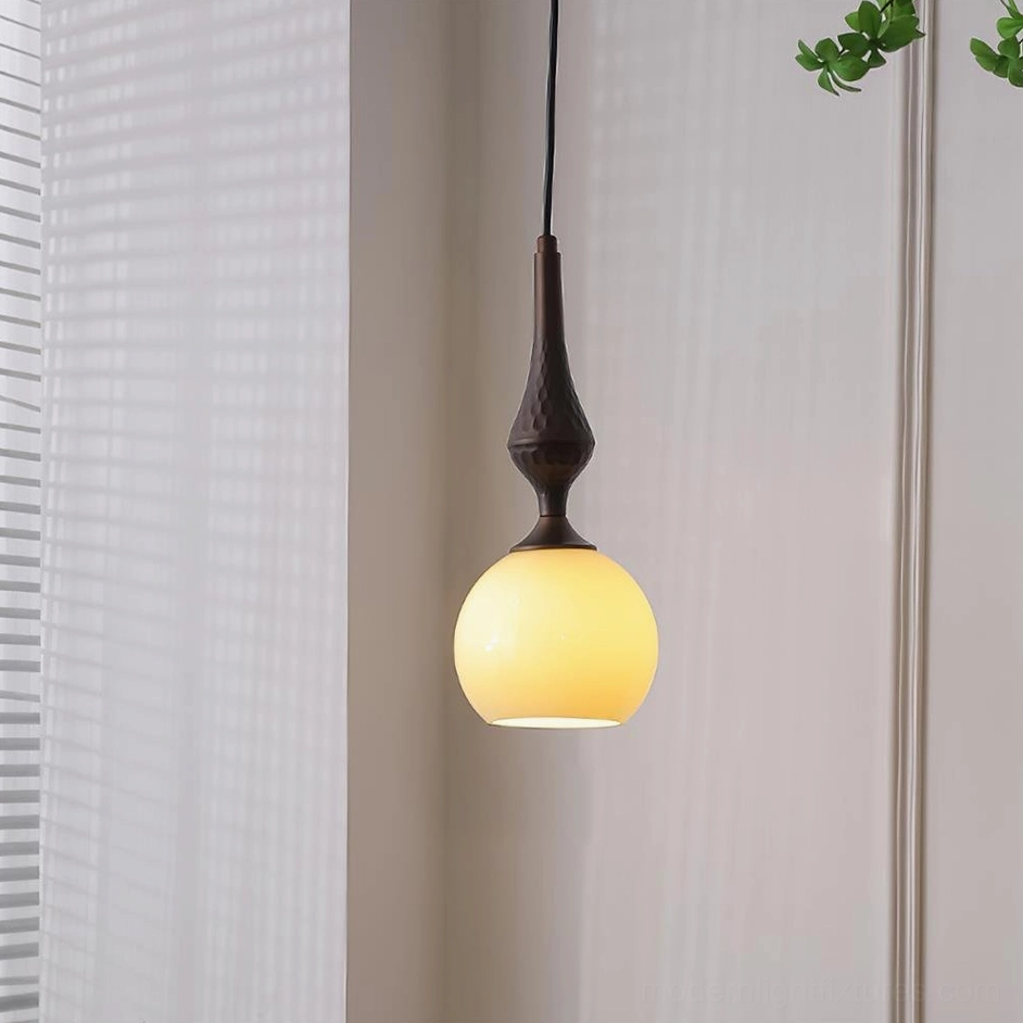 Model B medium pendant light fixture with gourd-shaped dark brown stem and cream glass shade