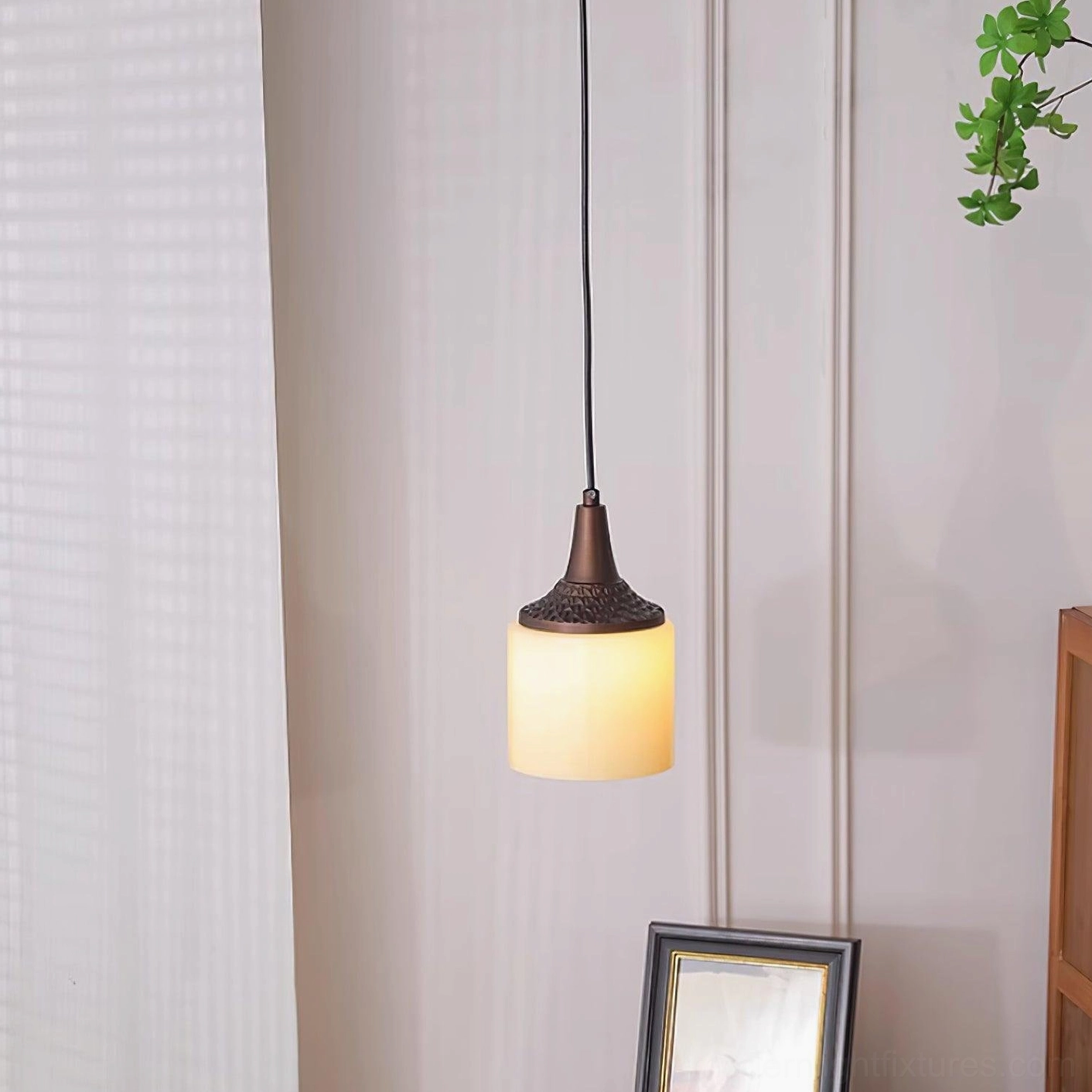 Three-quarter view of Eloise pendant lamp showing metal detail and frosted glass diffusion