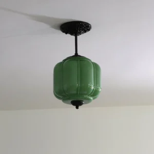 Eloise modern pendant ceiling lamp with green ribbed glass shade installed in residential room - low angle view