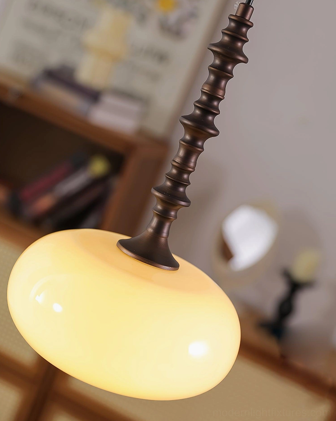 Overhead view of Eloise pendant light showing frosted glass shade and metal suspension system