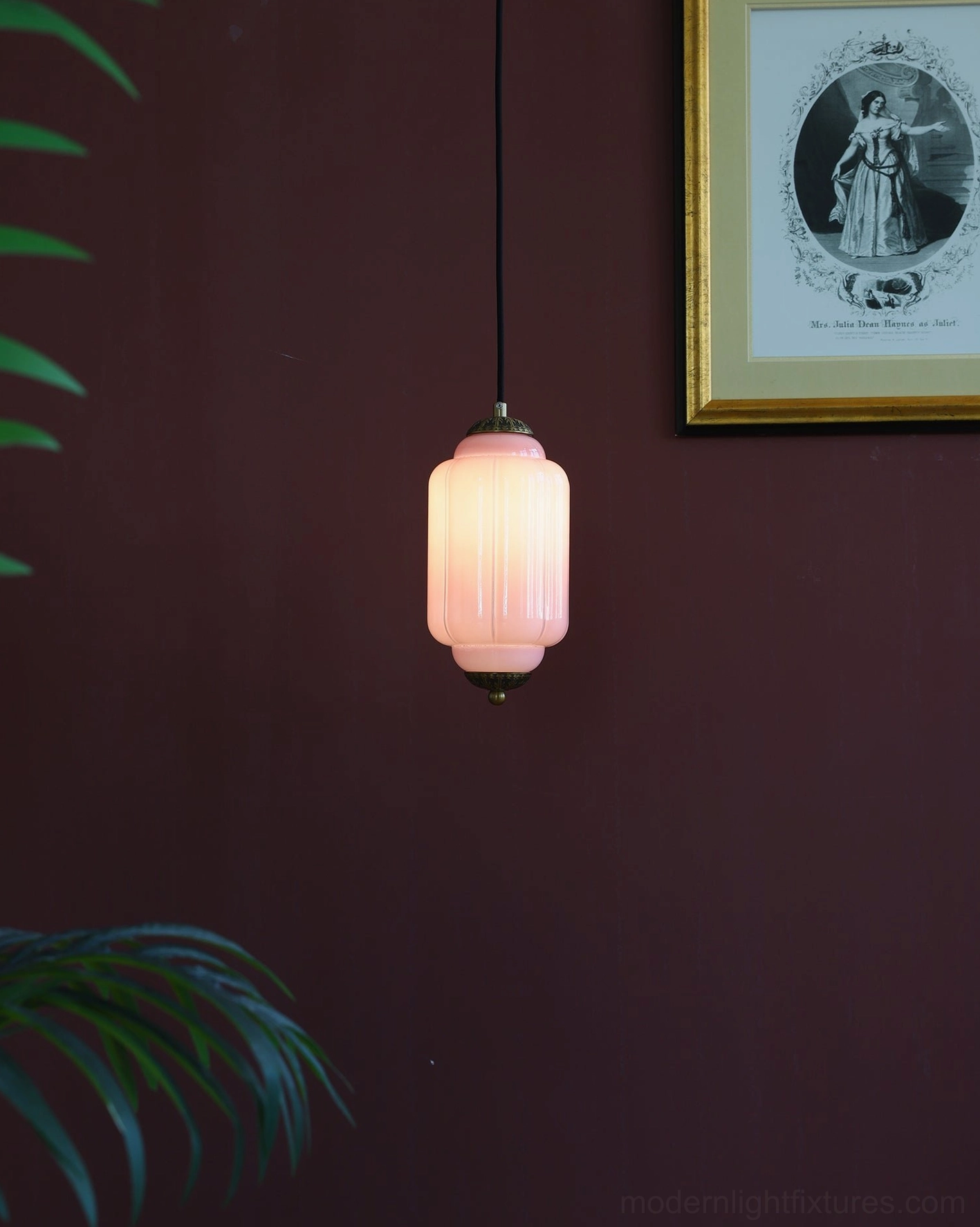 Fluted glass pendant light casting warm ambient light in residential interior